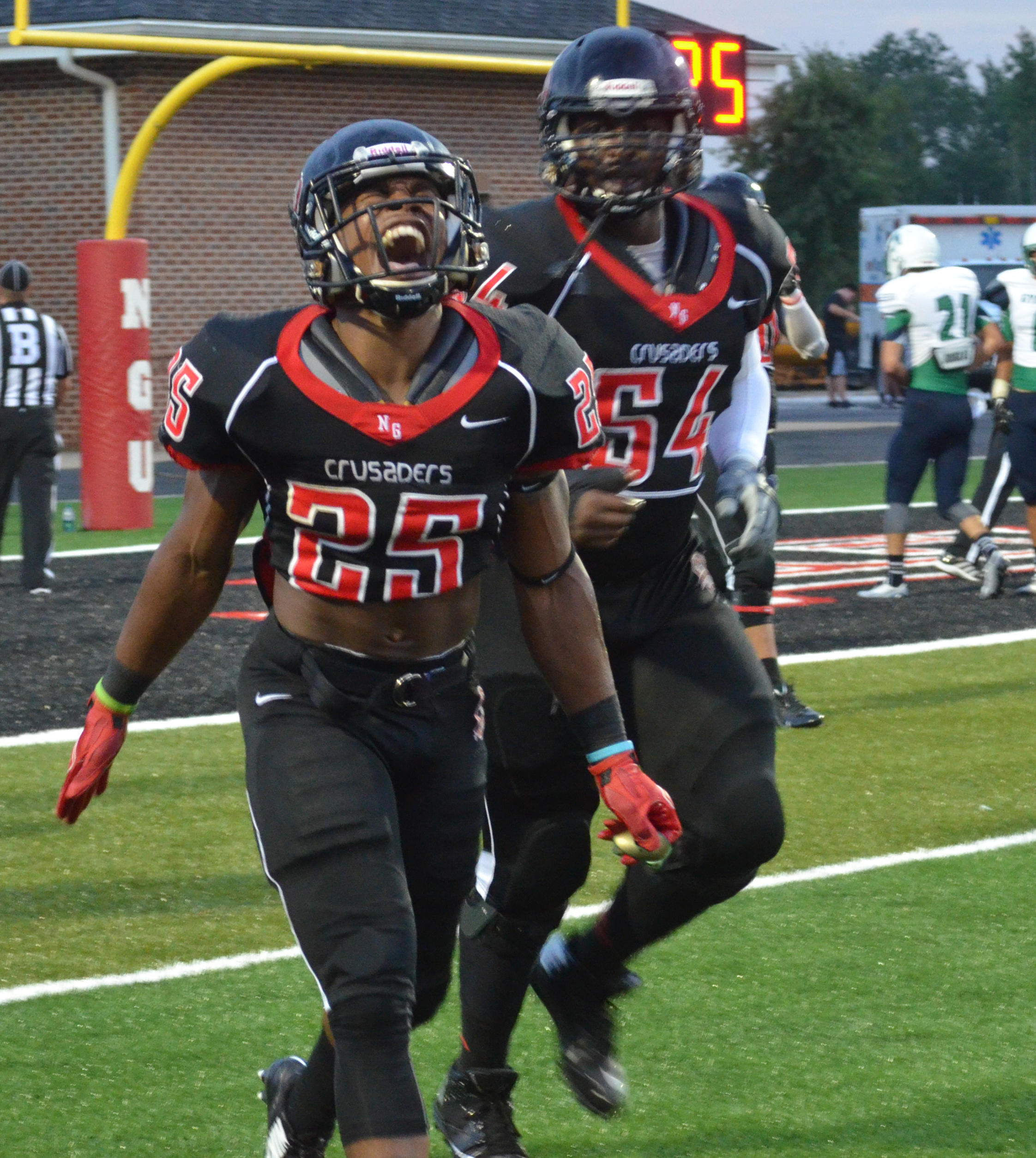 Number 25, Ashton Heard, is pumped about scoring a touchdown