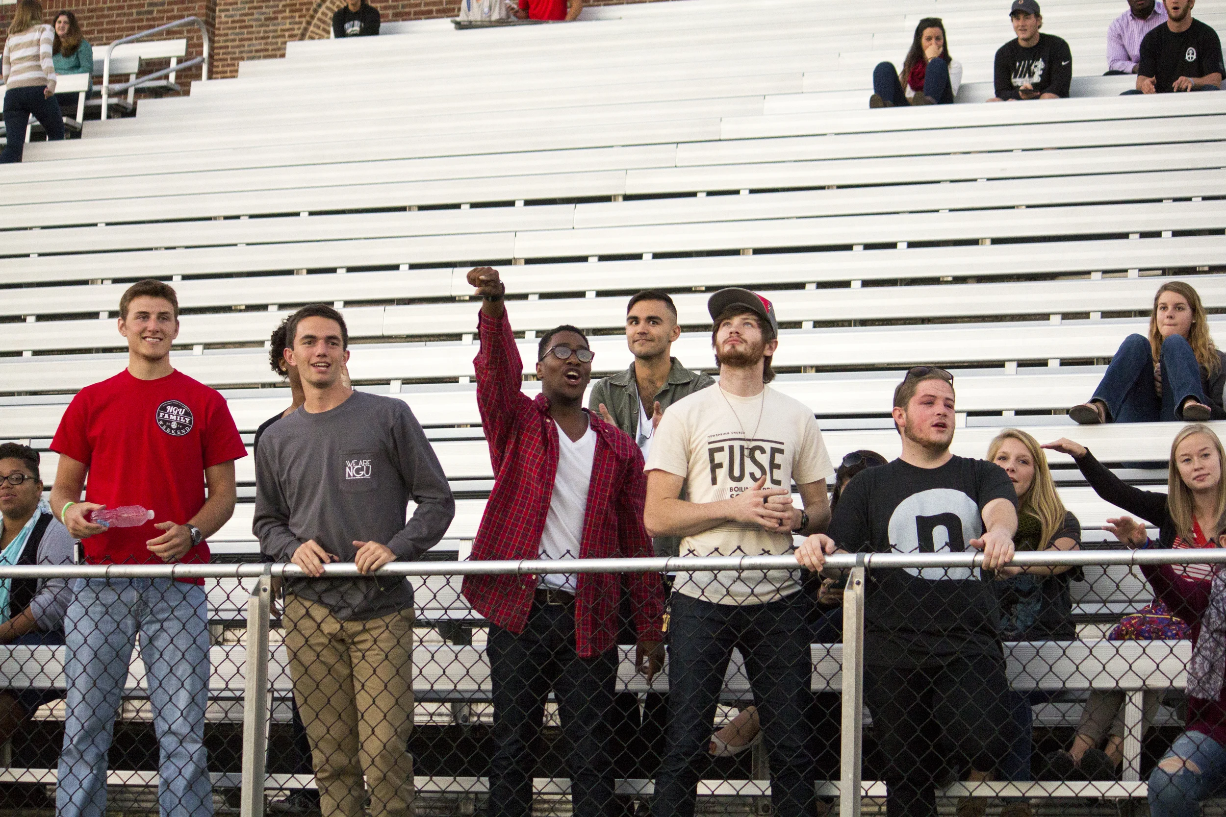 Some senior guys cheer on their fellow senior ladies during the powderpuff football game. 
