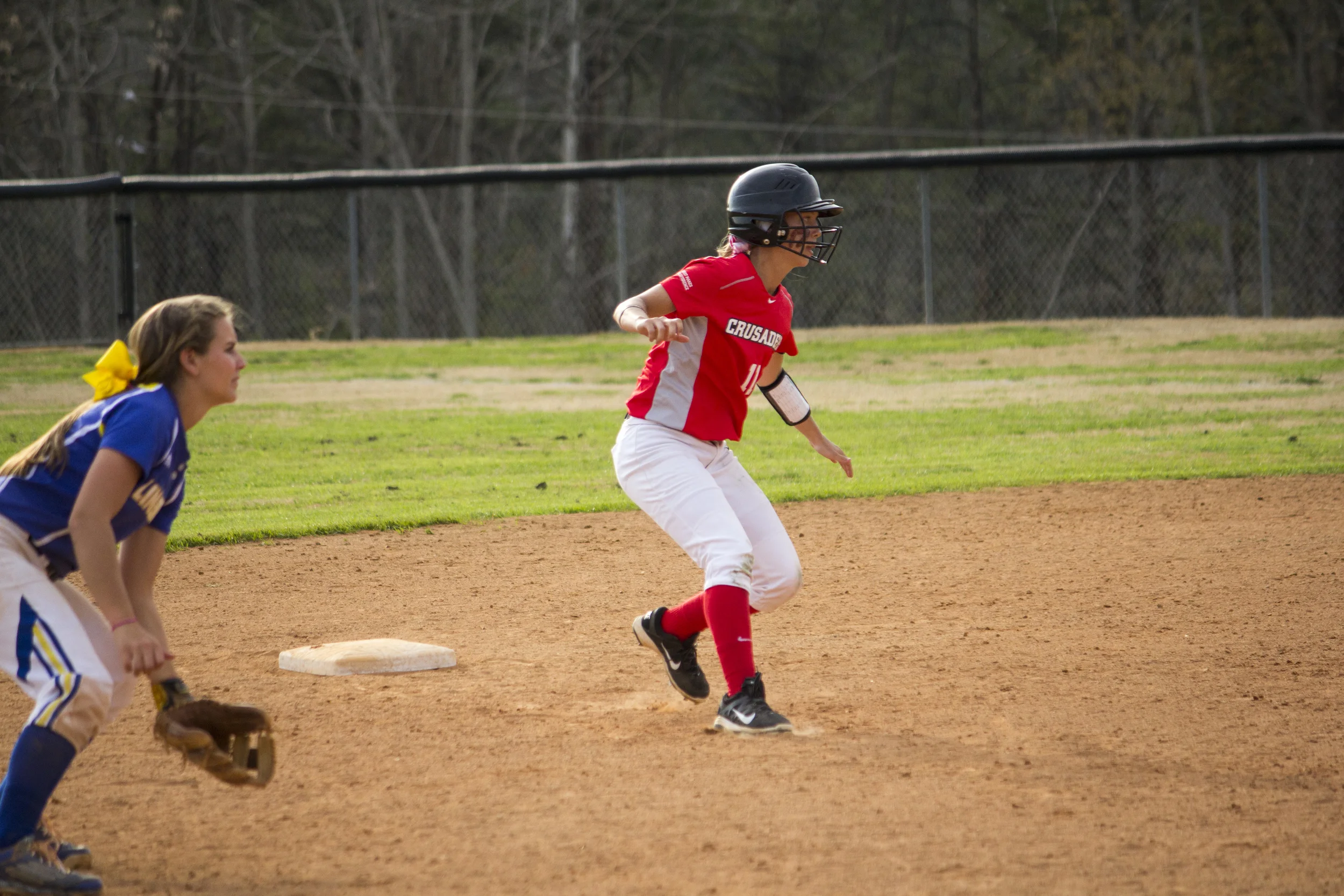 Freshman Tracy Howell cautiously makes a run for third base.