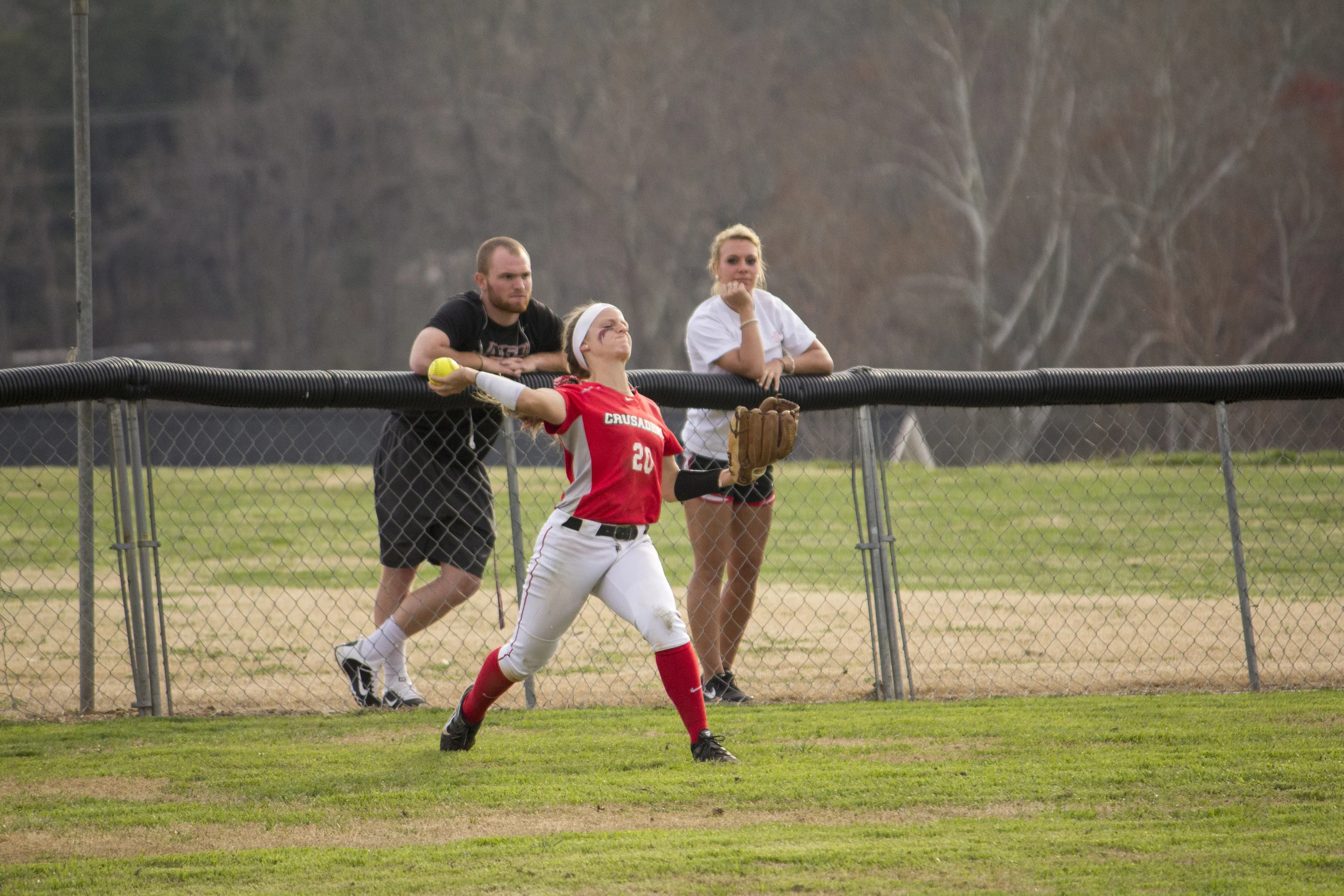 Senior Sarah Armstrong launches the ball to her teammate in the infield. 