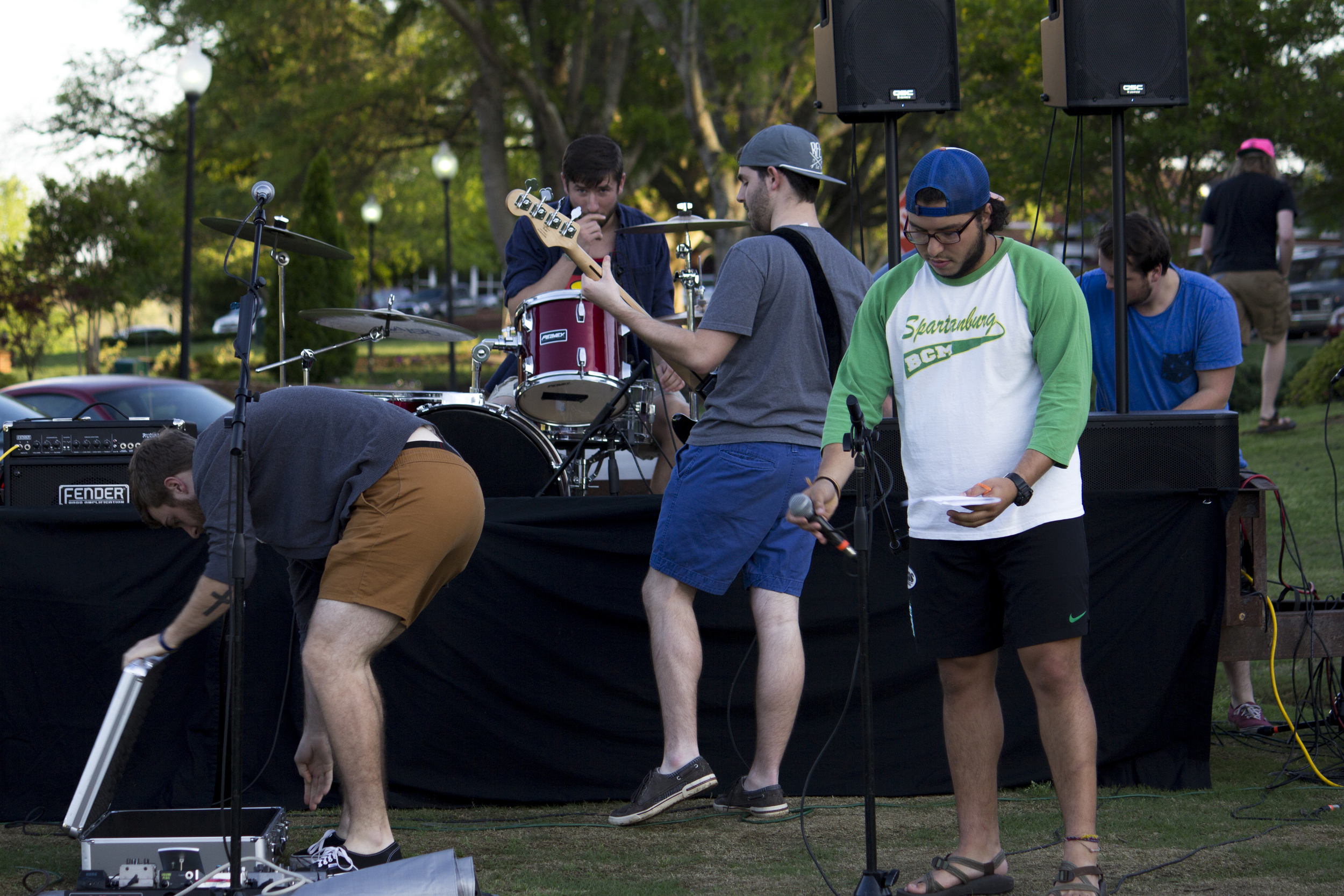 Members of different bands test out their gear while the sound guys run last minute tests. 