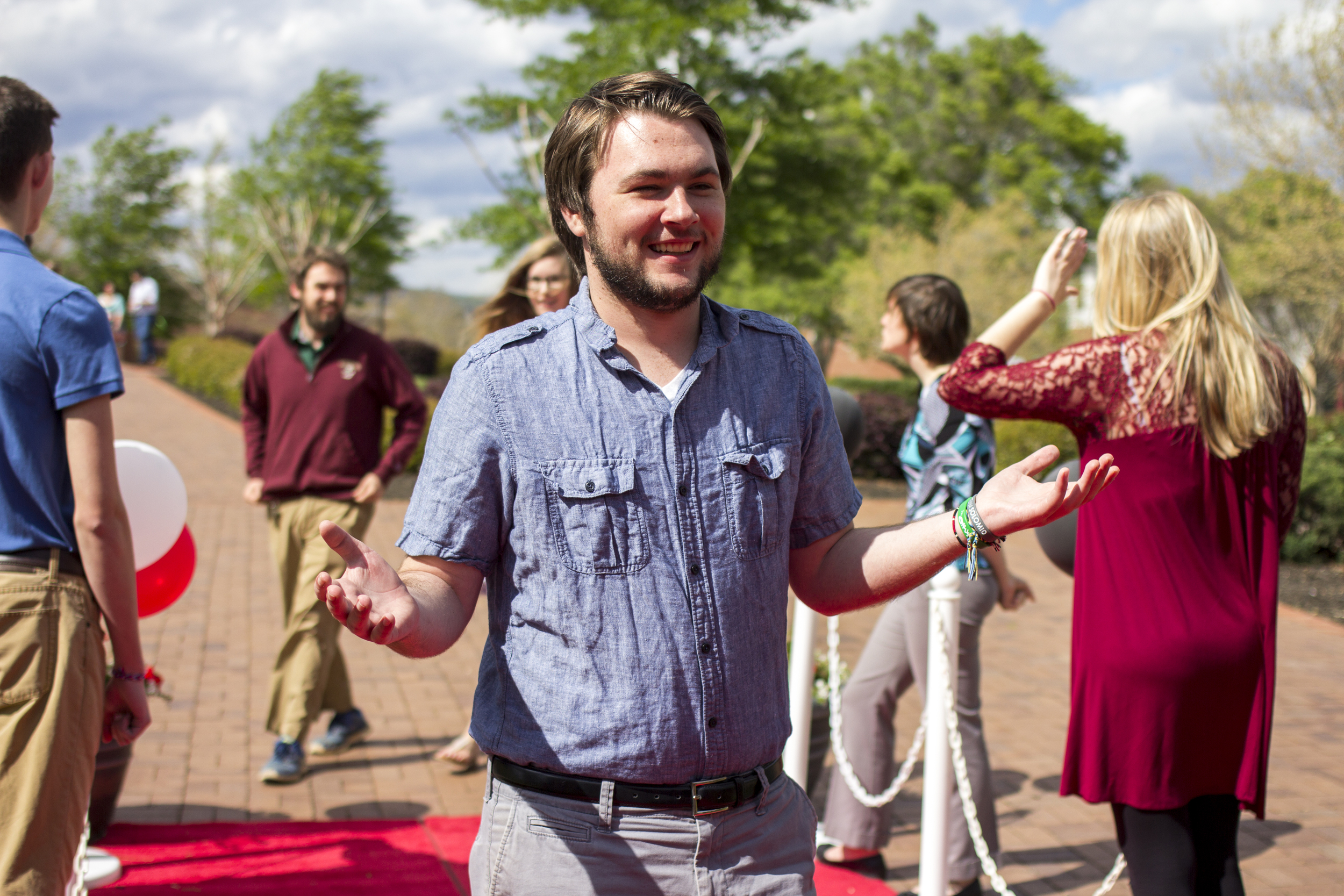 Max Millsaps laughs as he was told to strike a pose. Shrugging his shoulders, he acts as if a red carpet event is just another normal day in the life of Max Millsaps. 