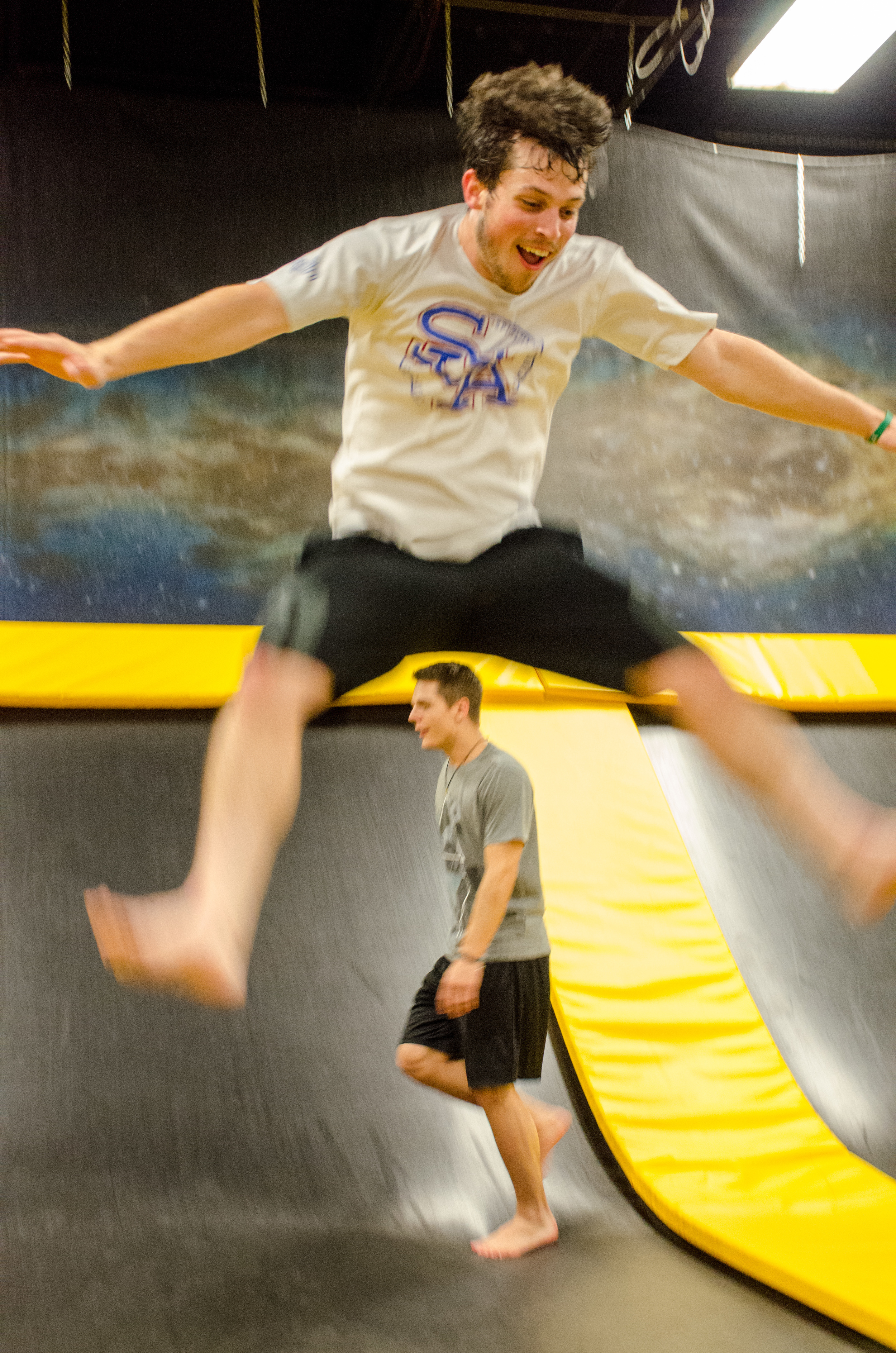 Daniel Shamblin jumps as high as he can trying to touch his toes. 