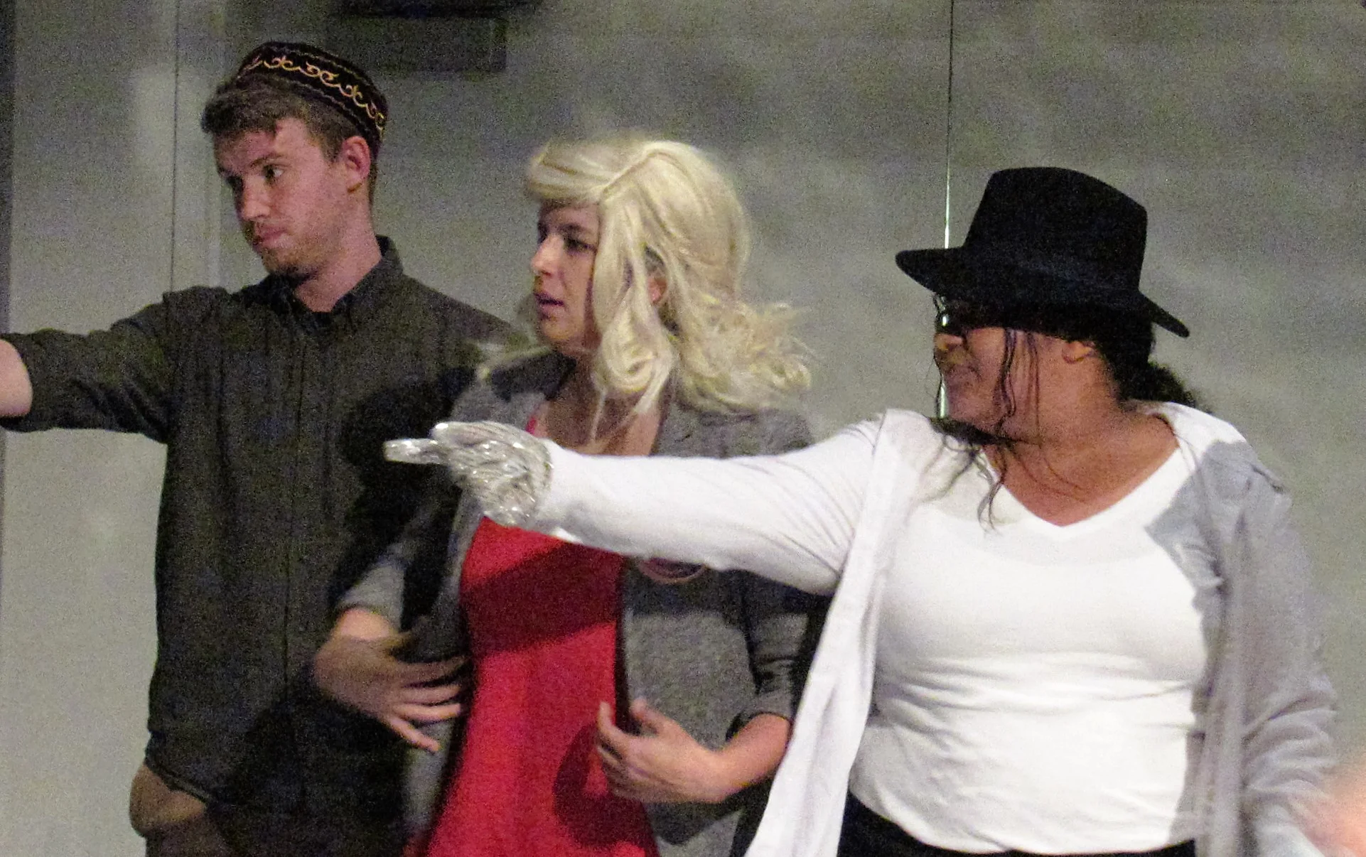 James Gilbert (left), Emily Smith (center) and DeAndra Watkins (right) improvise a party scene during October 31st's Required Chaos show. Image courtesy of Carson Myers. 