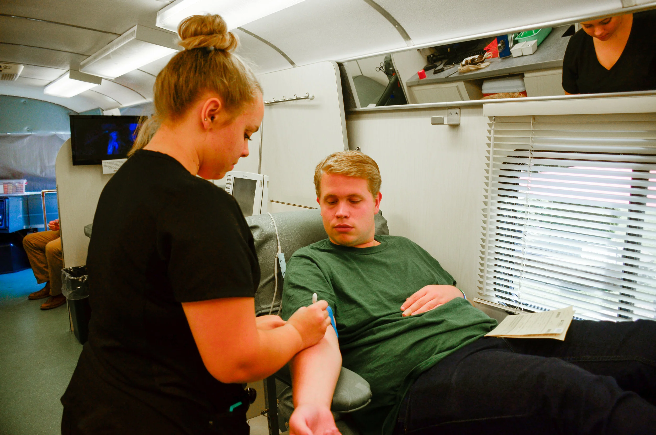 Austin Cathey, sophomore, prepares himself to donate blood because, "it's the right thing to do to help those who need blood." 