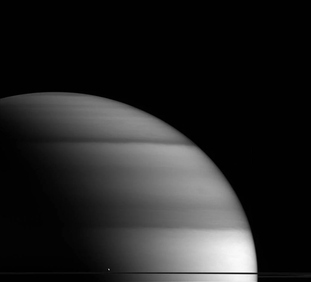 2. “The Dew Drop of Saturn” A tiny white spec compared to Saturn, Enceladus is the planet’s 6th largest moon.