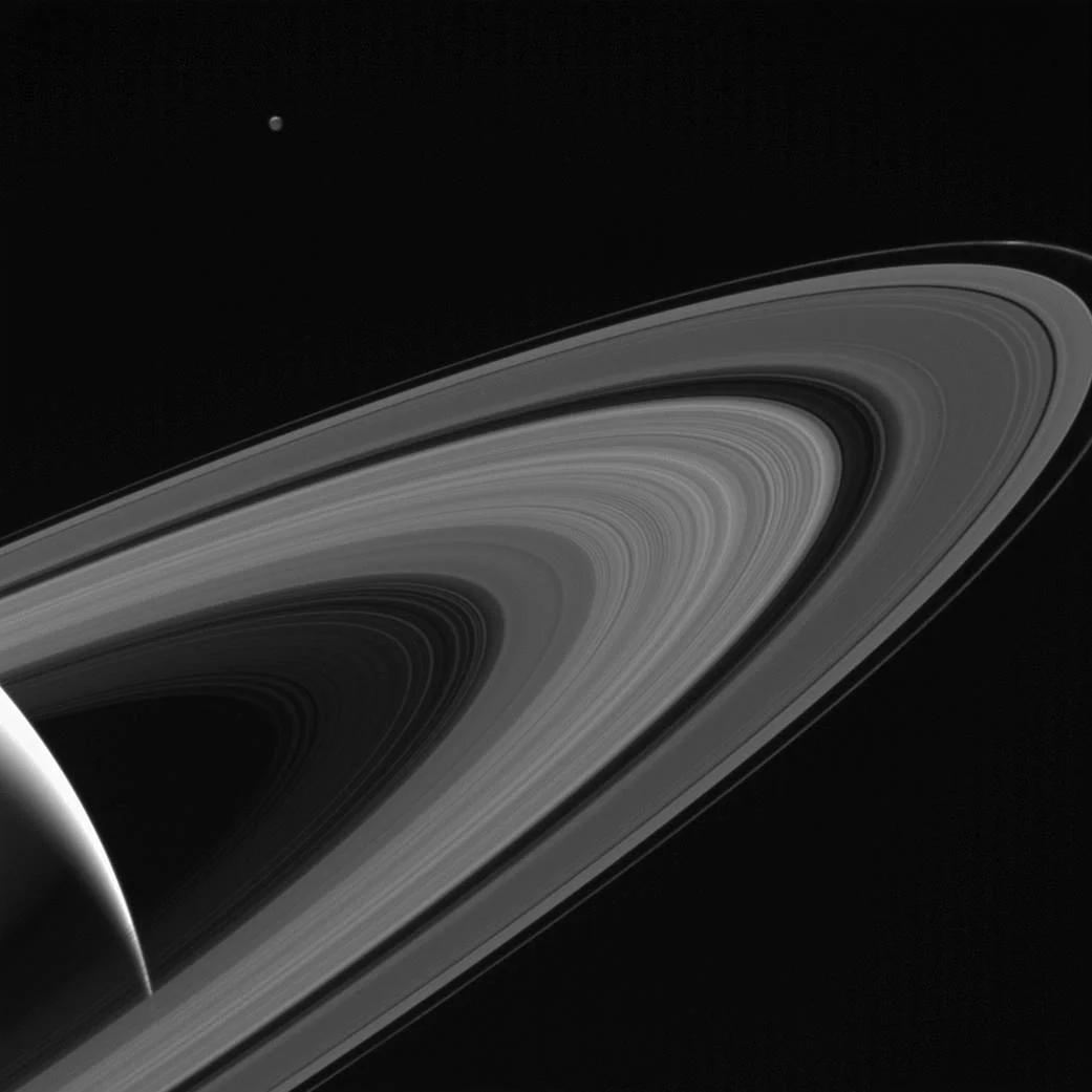 4. “Saturn-lit Tethys” The sun beautifully reflects off Tethys' rings, another one of Saturn's moons.