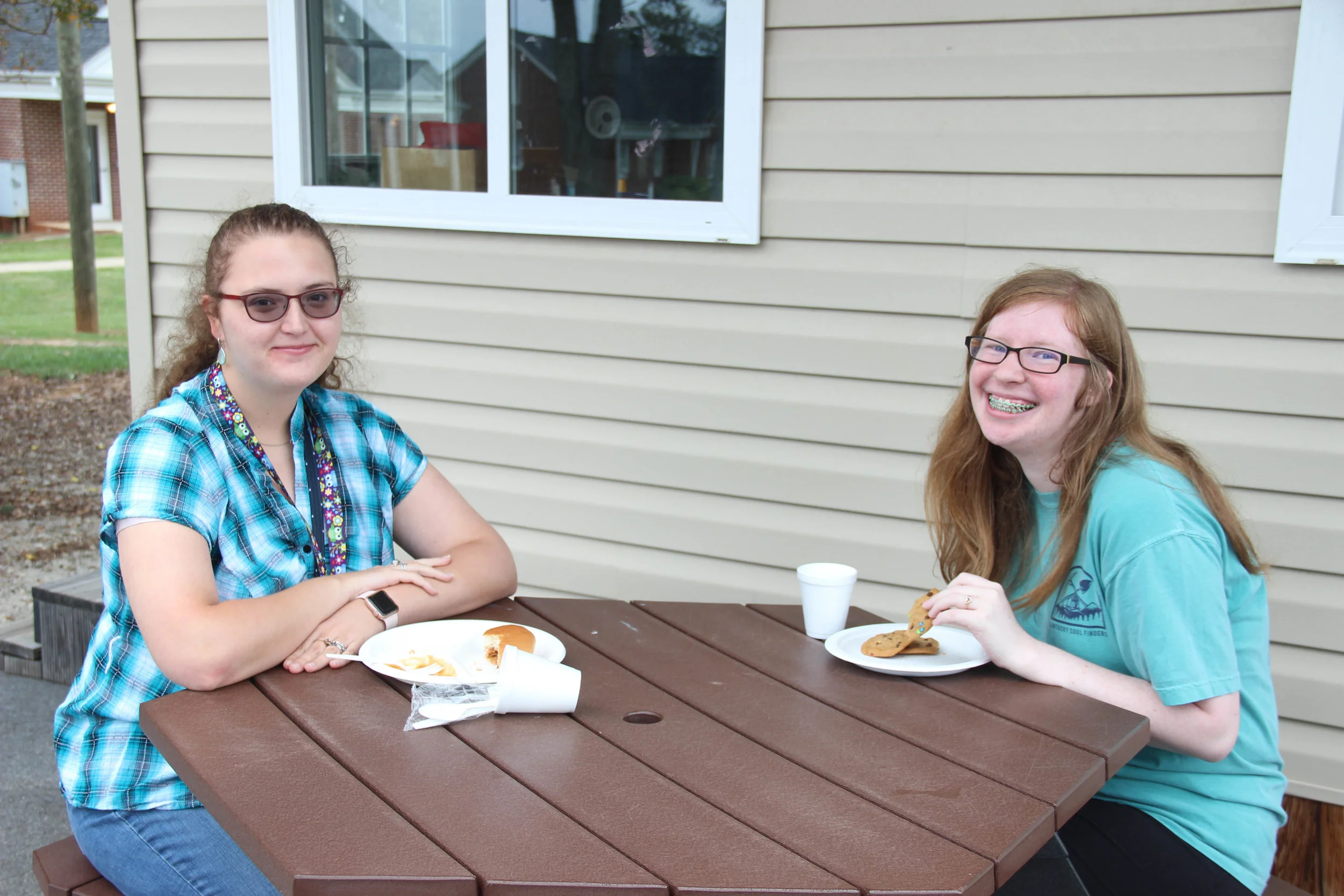 Savannah Mahaffey (Freshman) and Annie Holton (Sophomore) enjoying dinner at the Dinner and Bonfire.