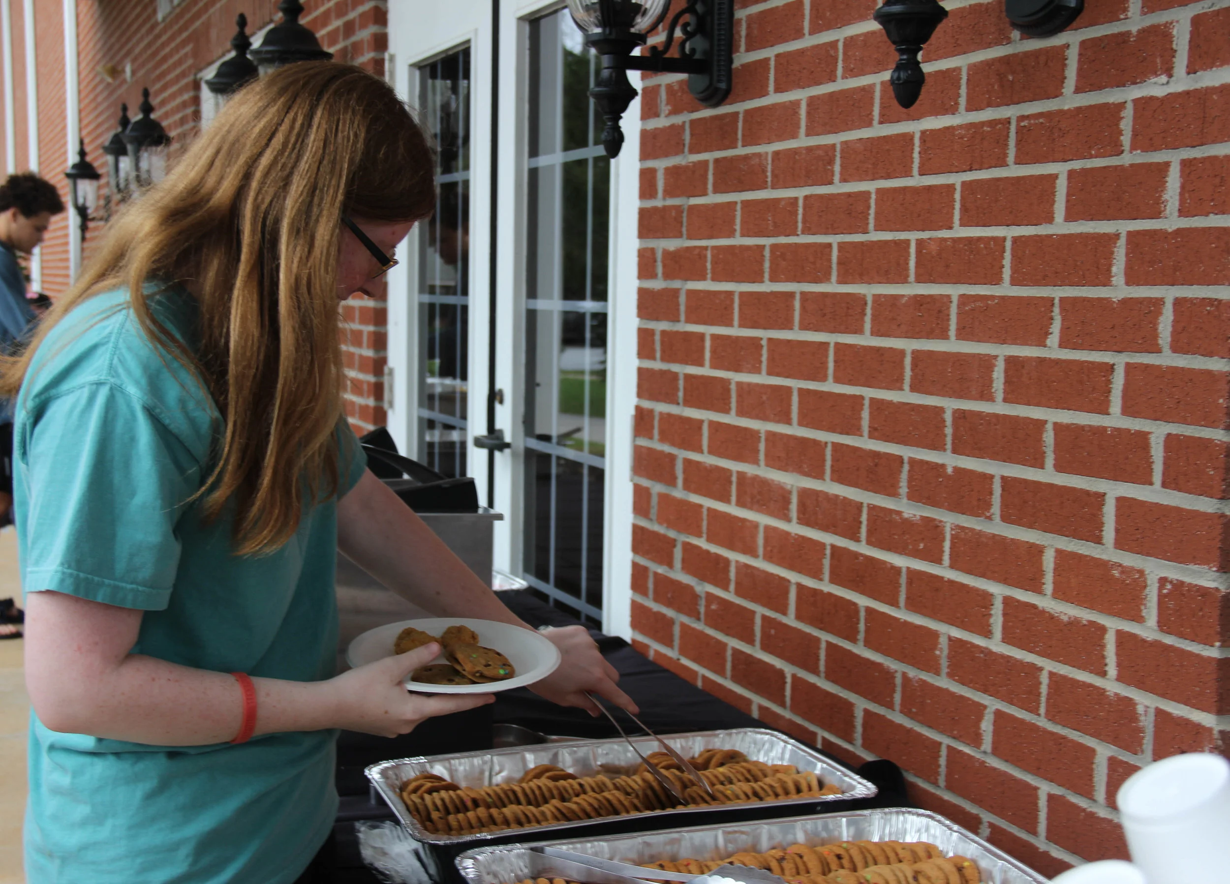 Annie Holton (Sophomore) going through the yummy food line.