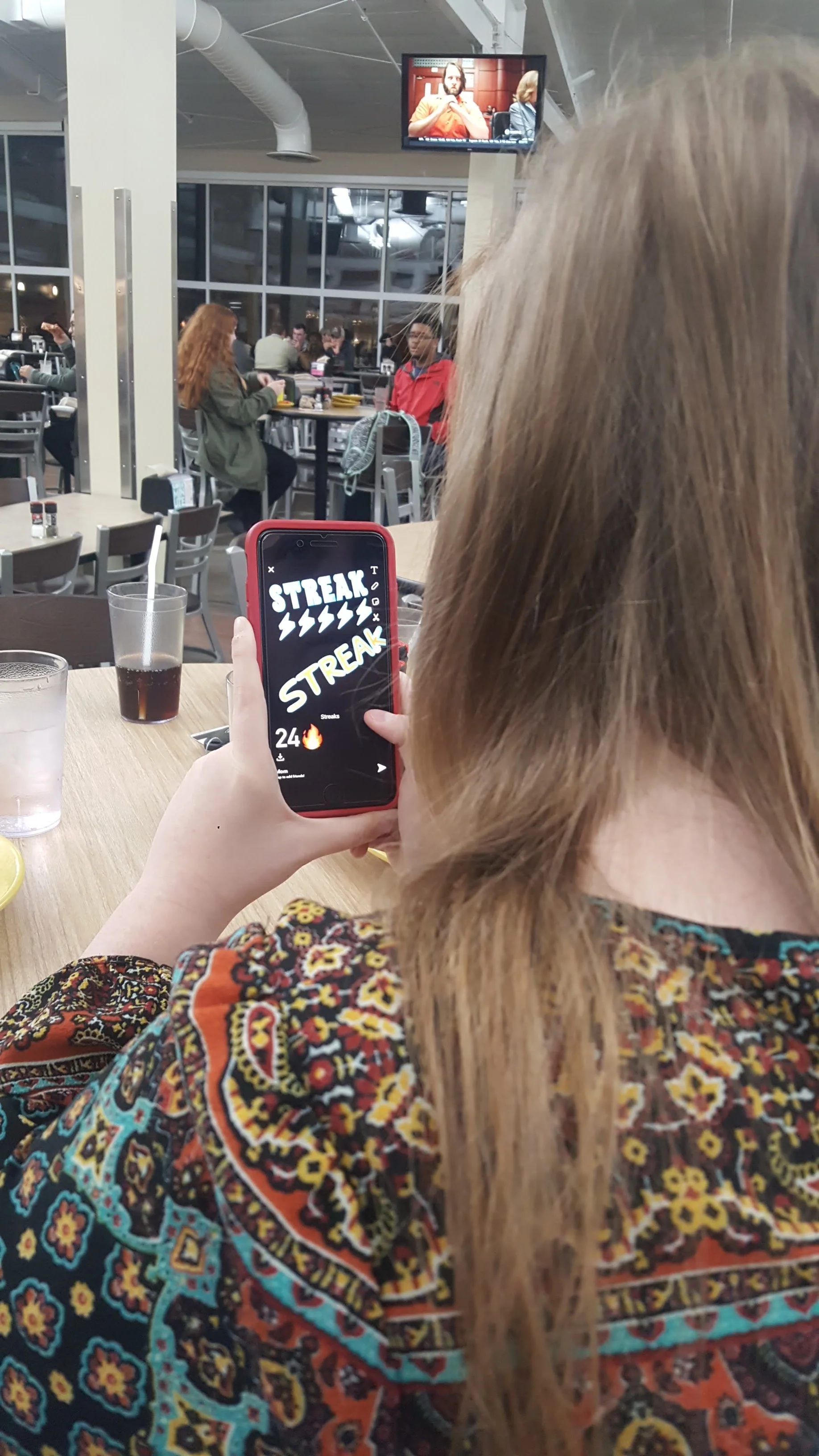 Sophomore Mary Mahan sends a snapchat to a friend. 