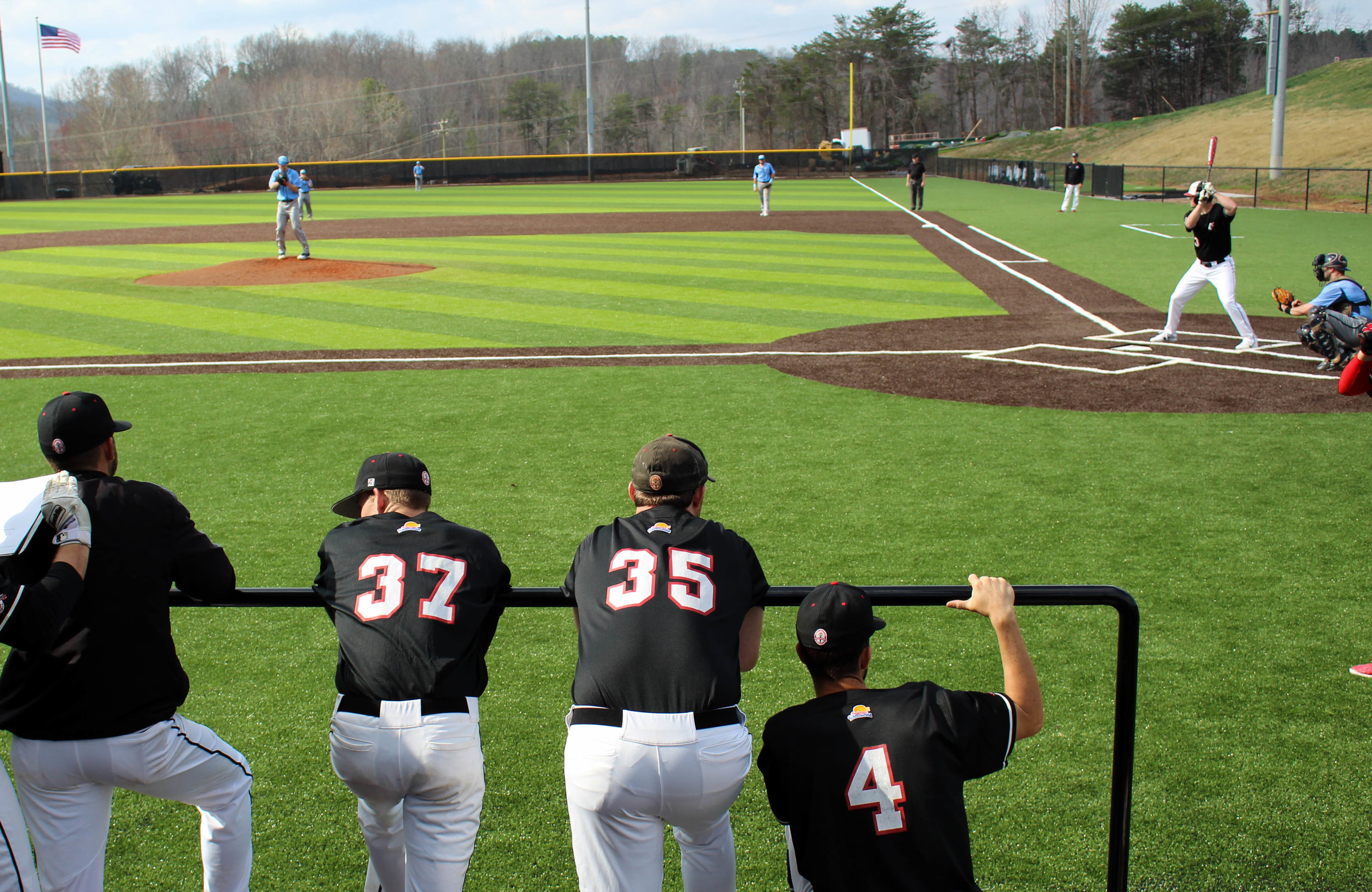 Ethan Struthers (37), Blake Hamilton (35) and Canaan Cropper (4) look on in support as Ryan Brown (3) is up to bat.