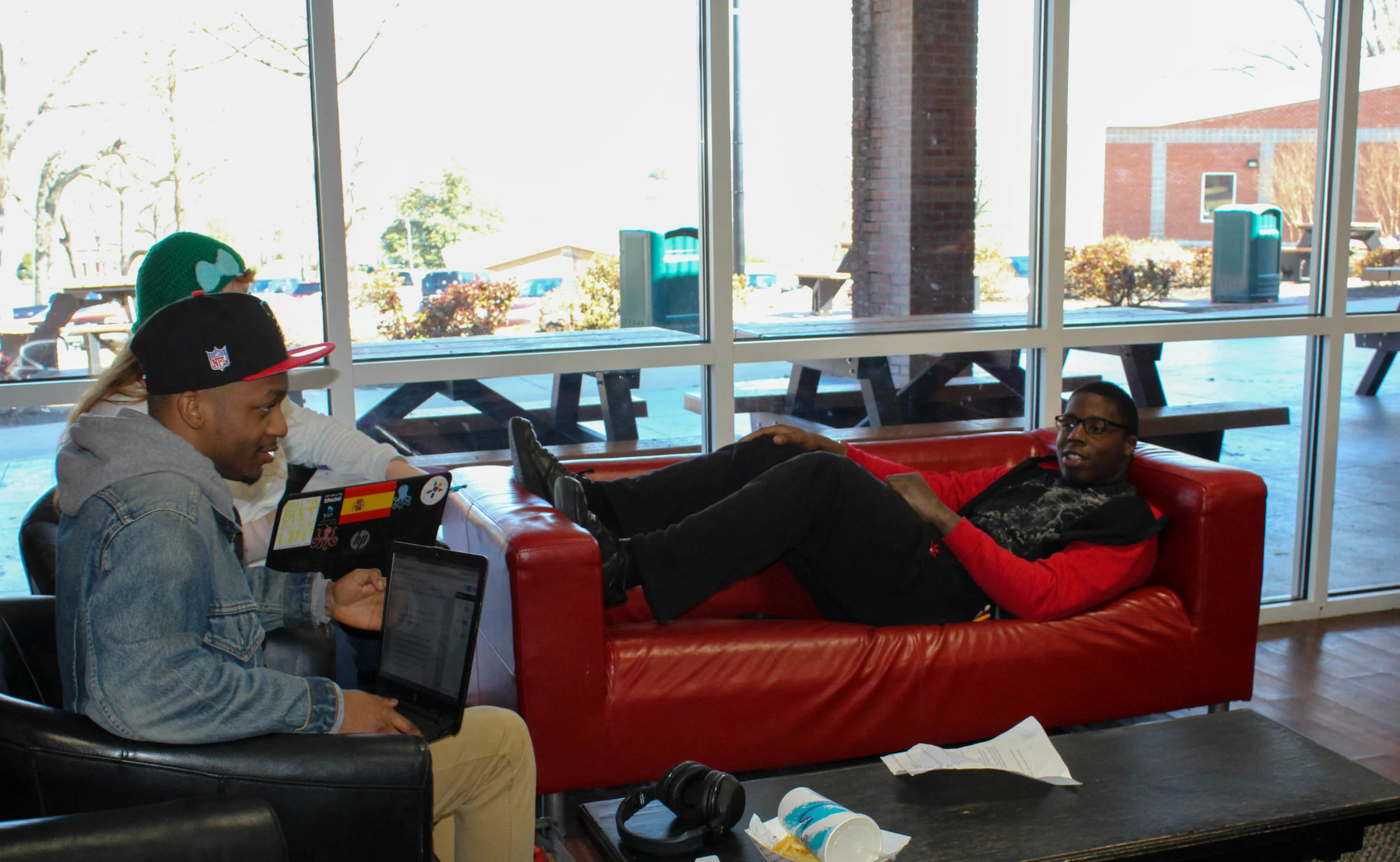 Freshman double major in digital media and computer science DJ Hillson, freshman biology major Christina Rafferty and freshman mathematics major Elyjah Lipscomb hang out and talk in the stud.