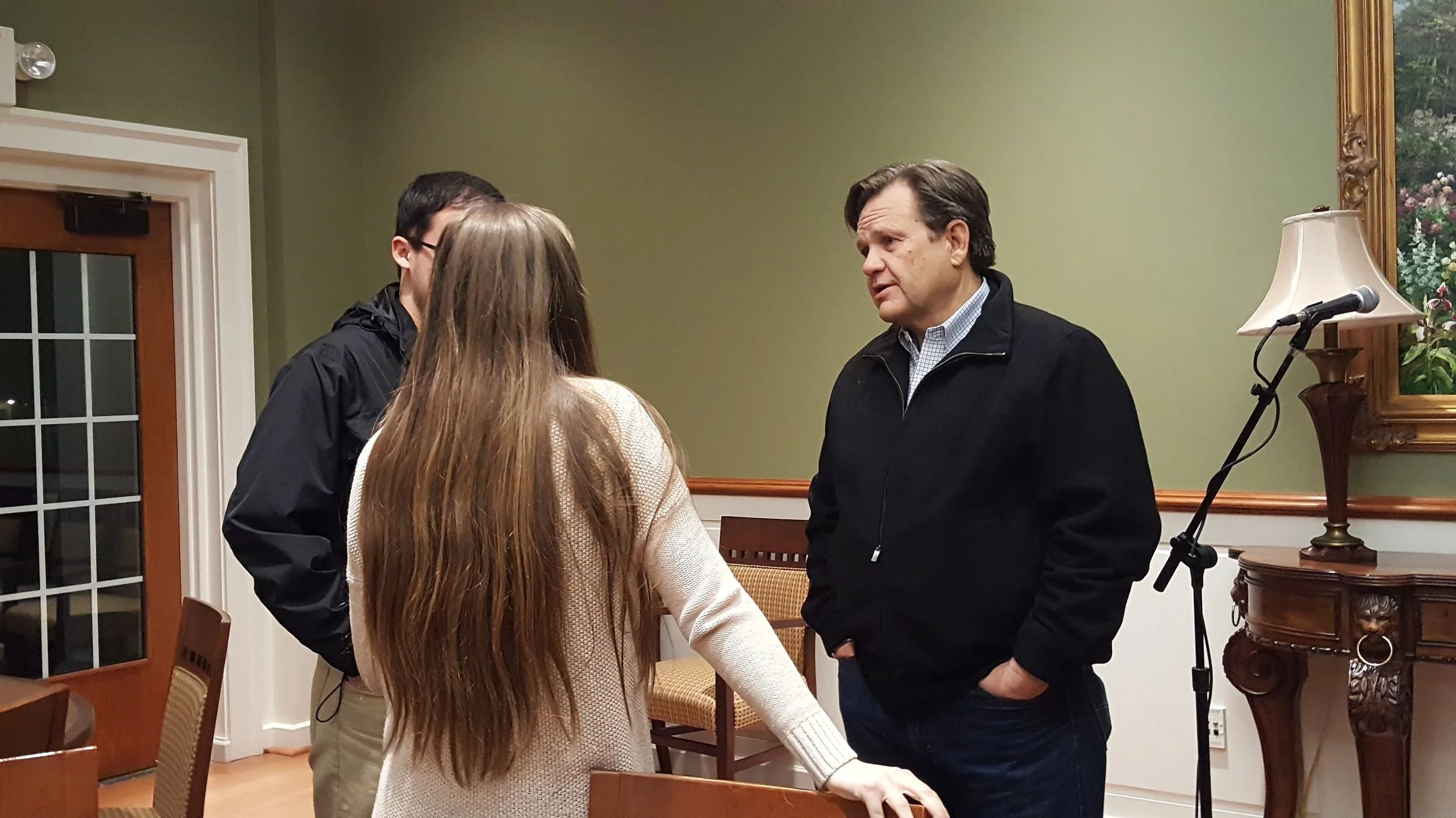 Senior Will Goubert and junior Tori Sheriff talk with NGU President Gene Fant after the forum. 