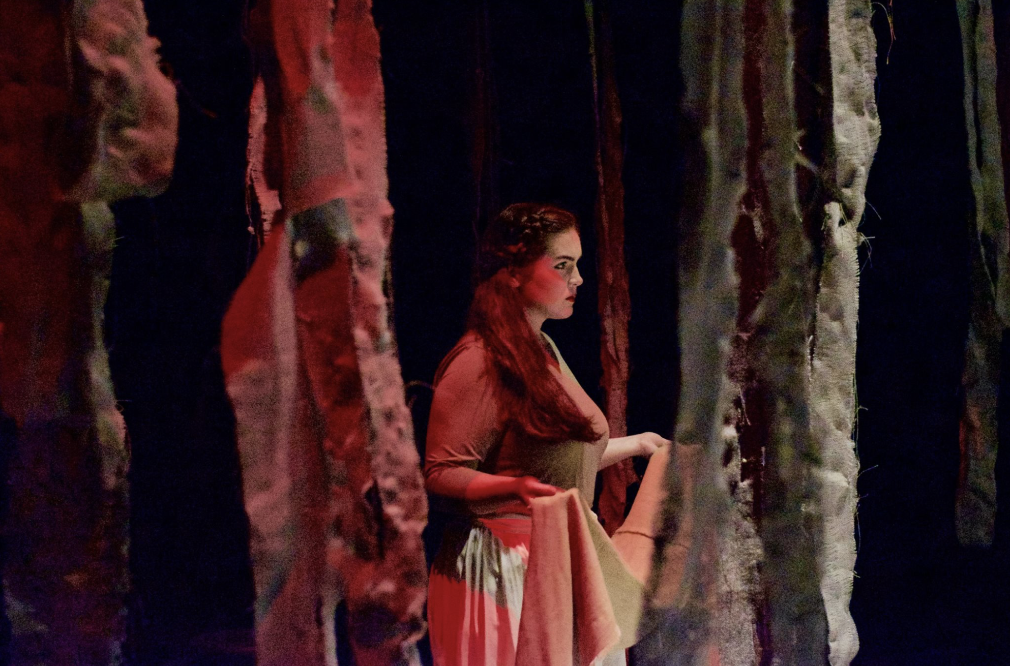 Ashlynn Butrovich (junior) glares fiercely into the audience as Antigone. Picture courtesy of NGU Theatre Facebook page