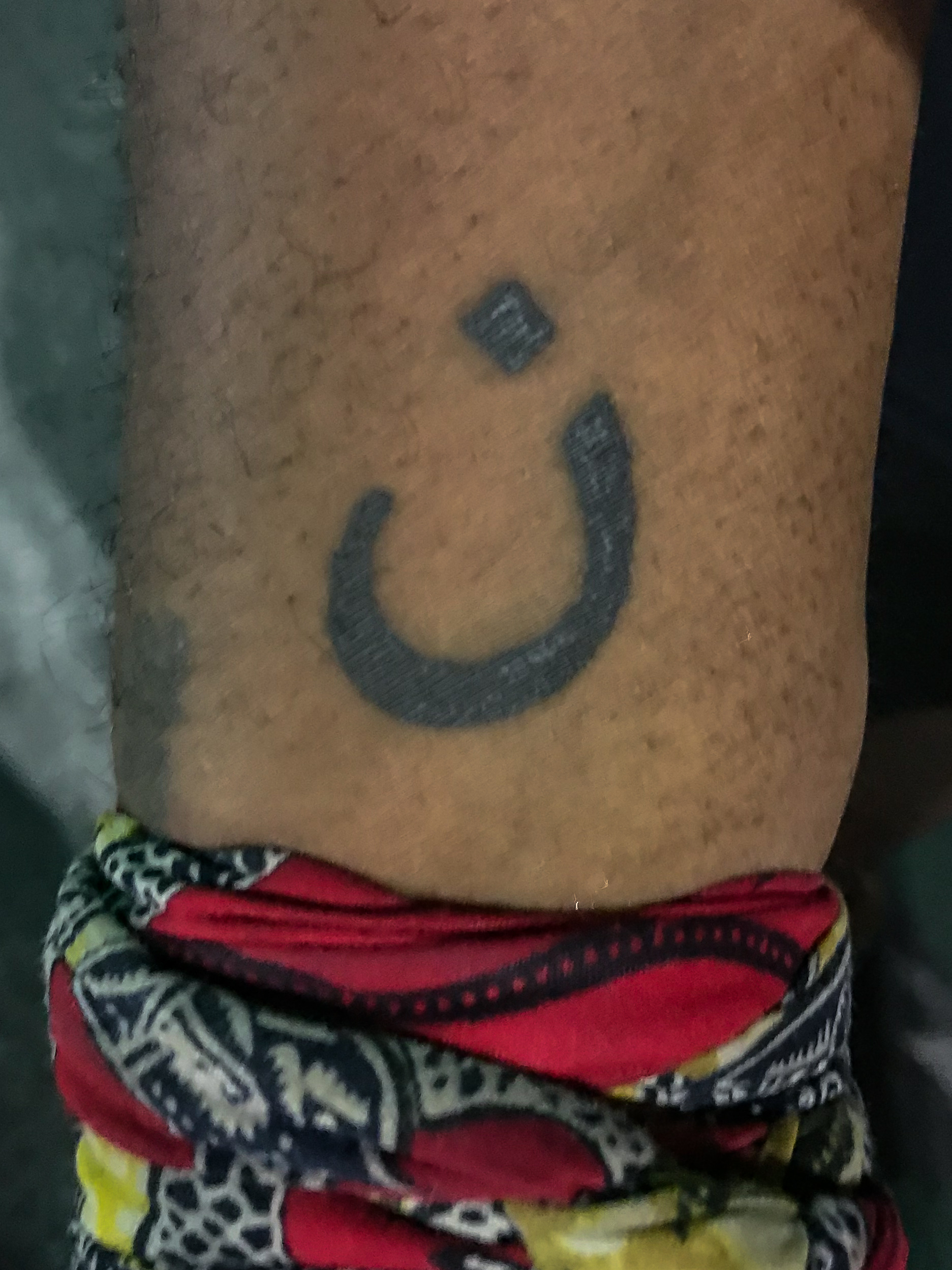 This is Mykel Perdue. This tattoo is the Arabic symbol for the letter ‘N’. It is to represent the Israelites crucified a Nazarene and Perdue relates to and is a brother of all persecuted Christians around the world.