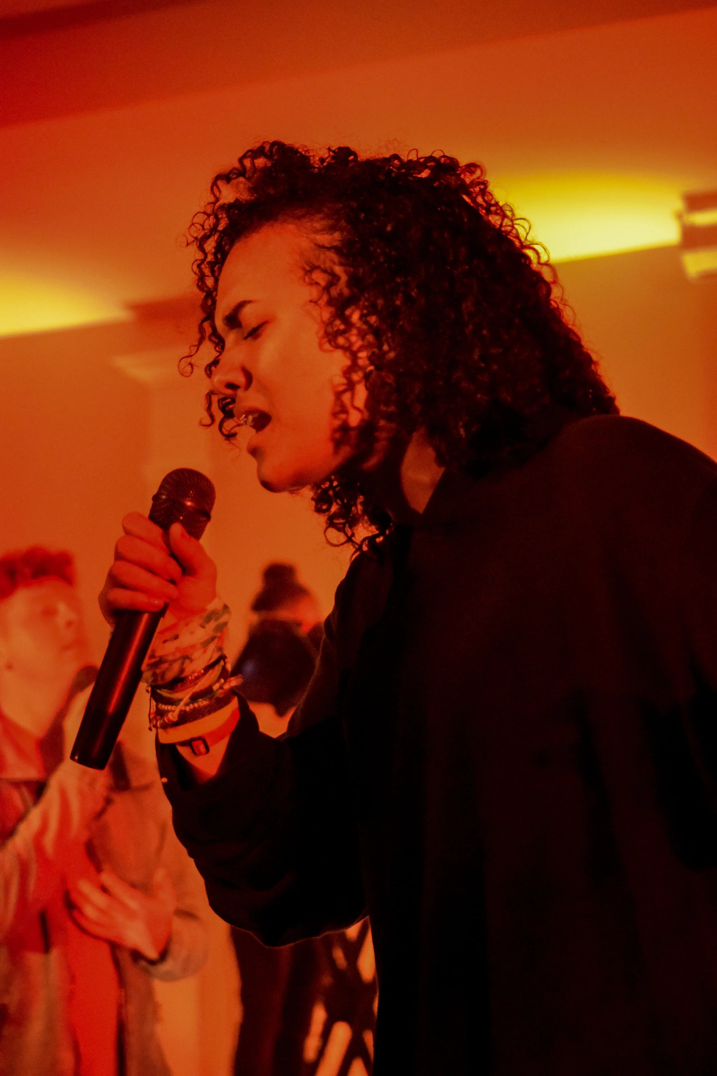 Friend of the band, sophomore Alexis Poole joins Urbanwood from Anderson University for their night of worship. She steps from the crowd and sings “Breaks Every Chain”.