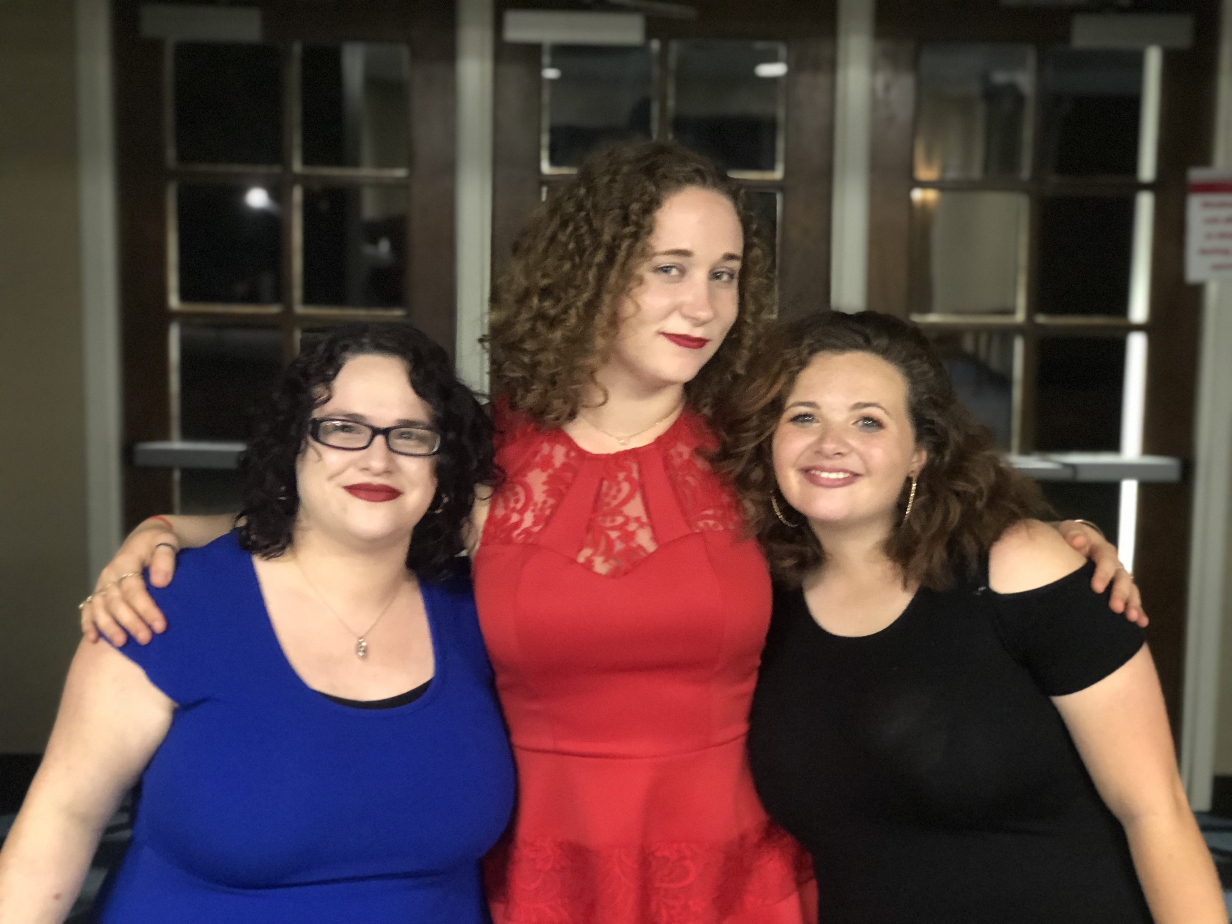 Senior, Francesca Scott, is posing before the dance with NGU alumni, Nisa Navarro and freshman, Angel Kelly, before the Homecoming Semi-Formal.