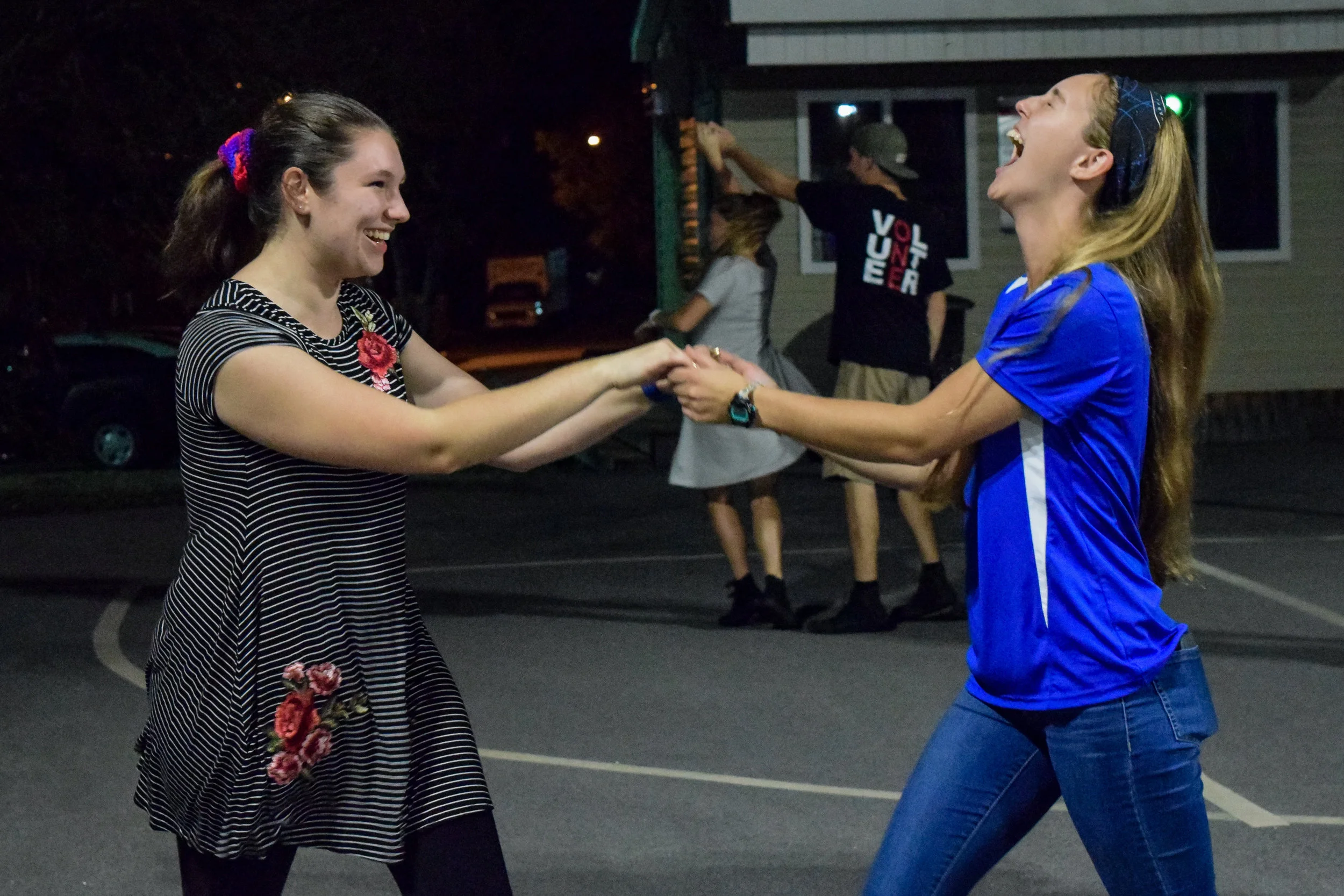 Freshman Sarah Campbell and sophomore Haley Suskin express their joy as they dance together, proving you don’t have to have a date to dance.