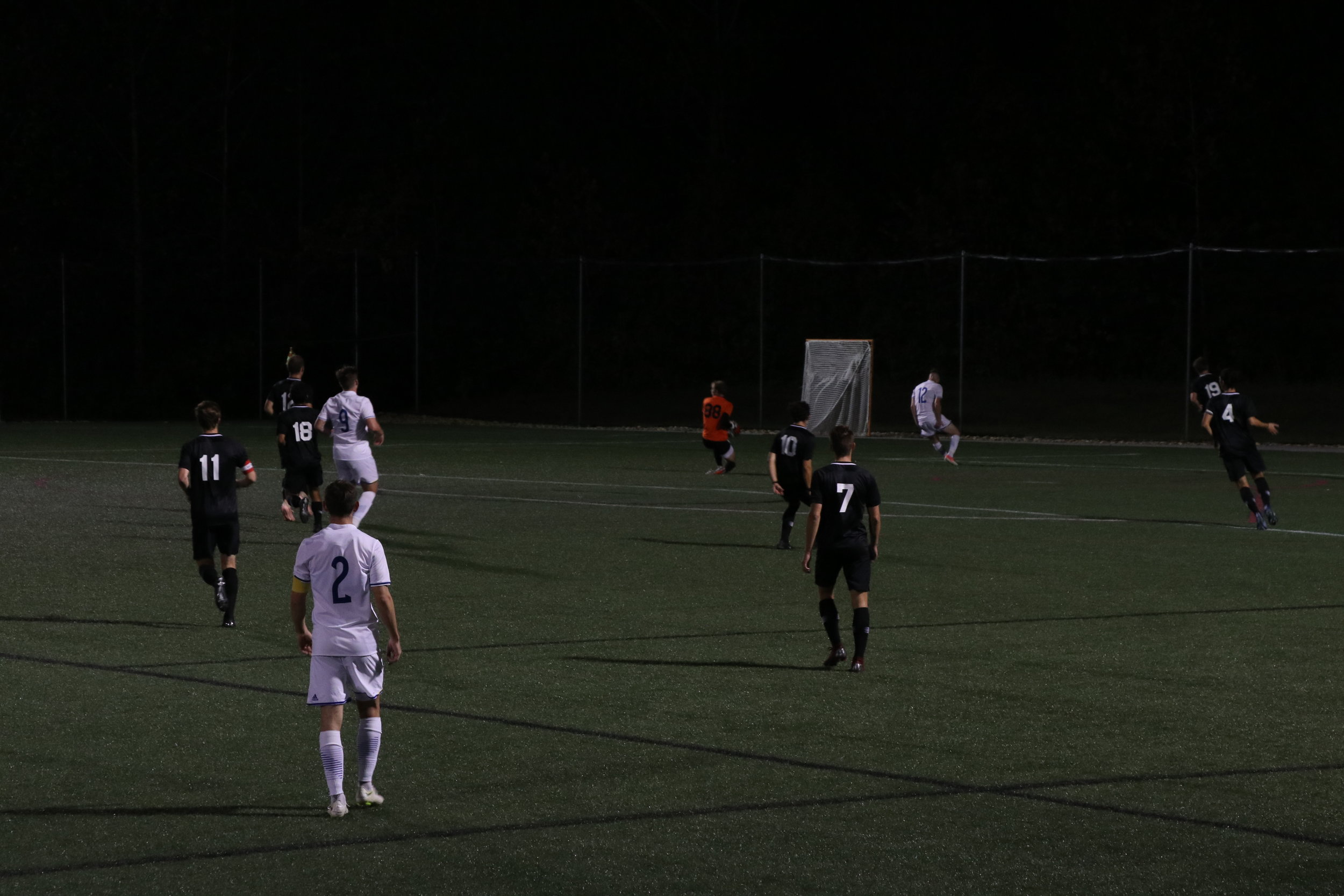 Goal keeper (88) sophomore, Noah Kendrick blocks the ball from going into the goal.