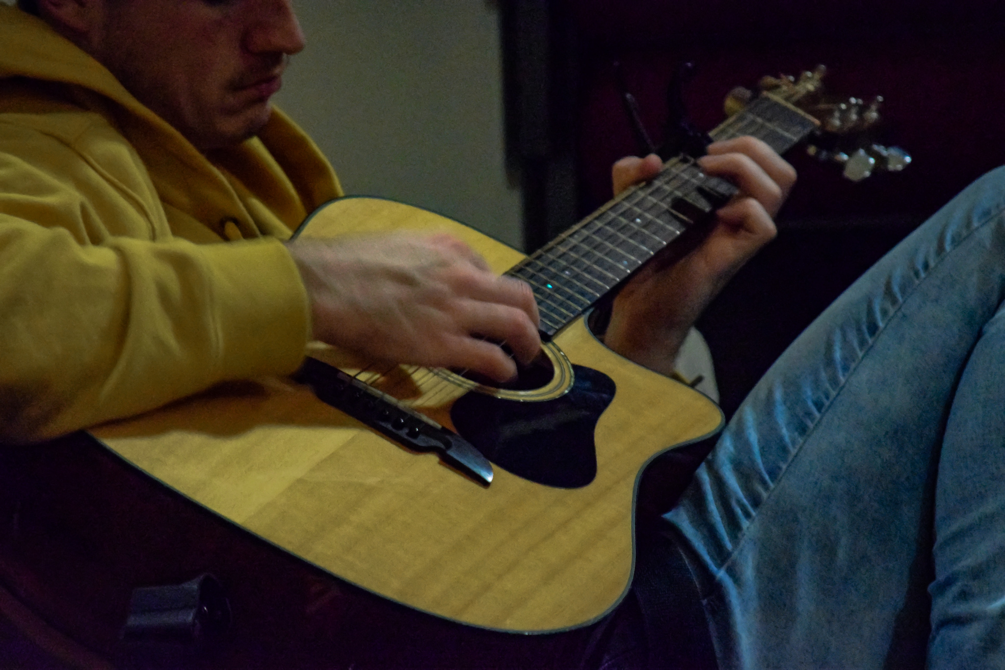 Senior, James Barnes provides some background music as the group plays.
