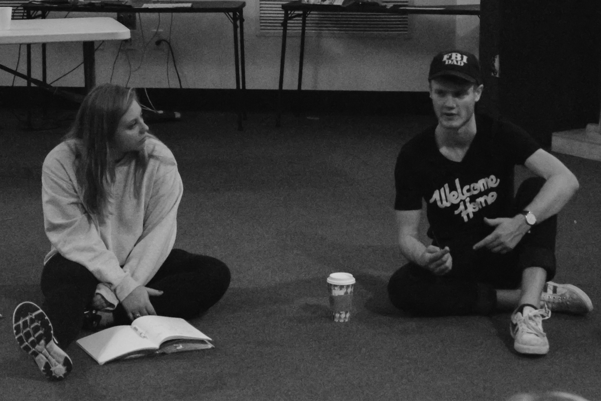 Kesey and Cable explain the next topic the group will pray over.