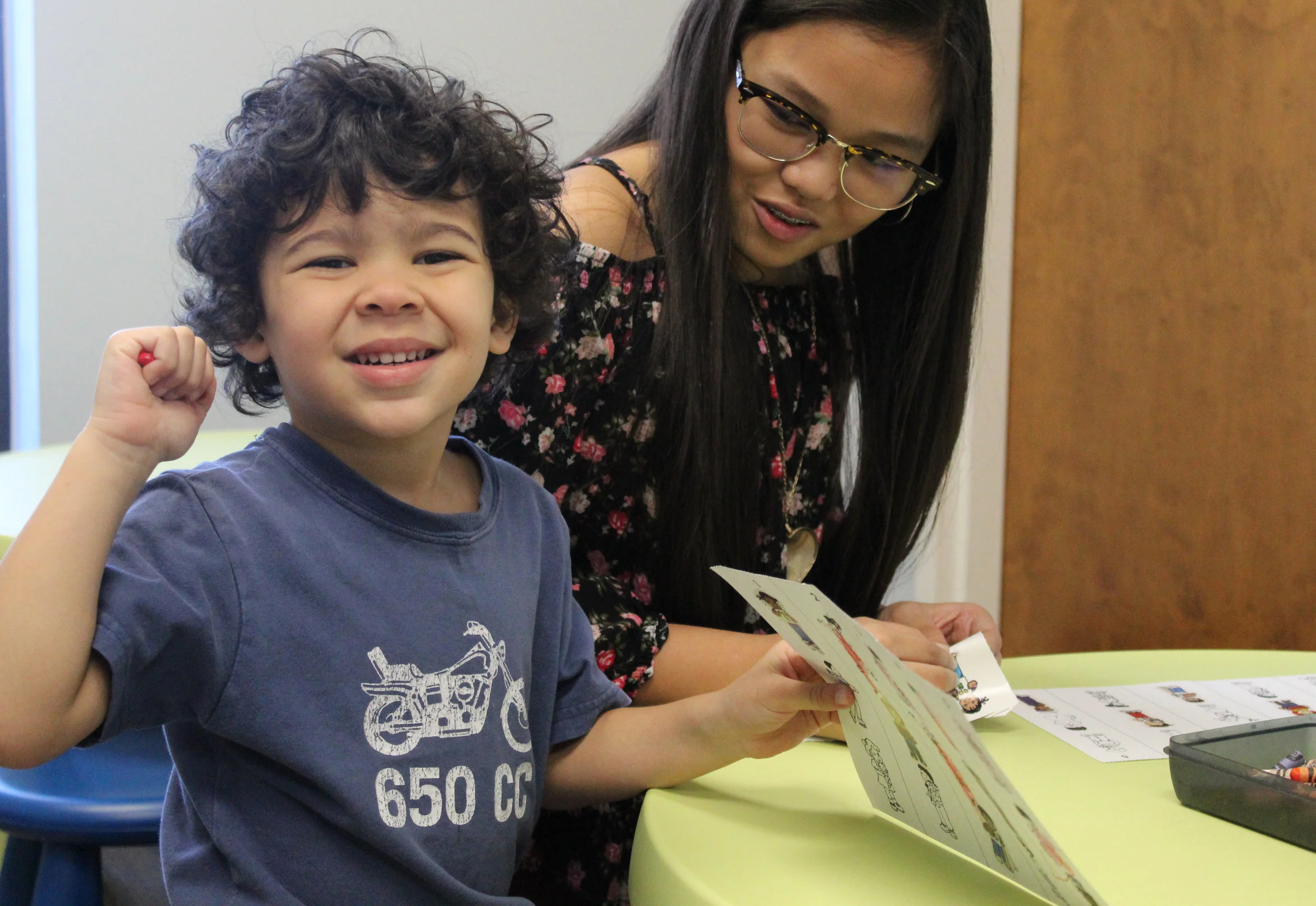 Kristen Pili teaches Owen Pringle about the twelve disciples in Toddler Trinity Kids.