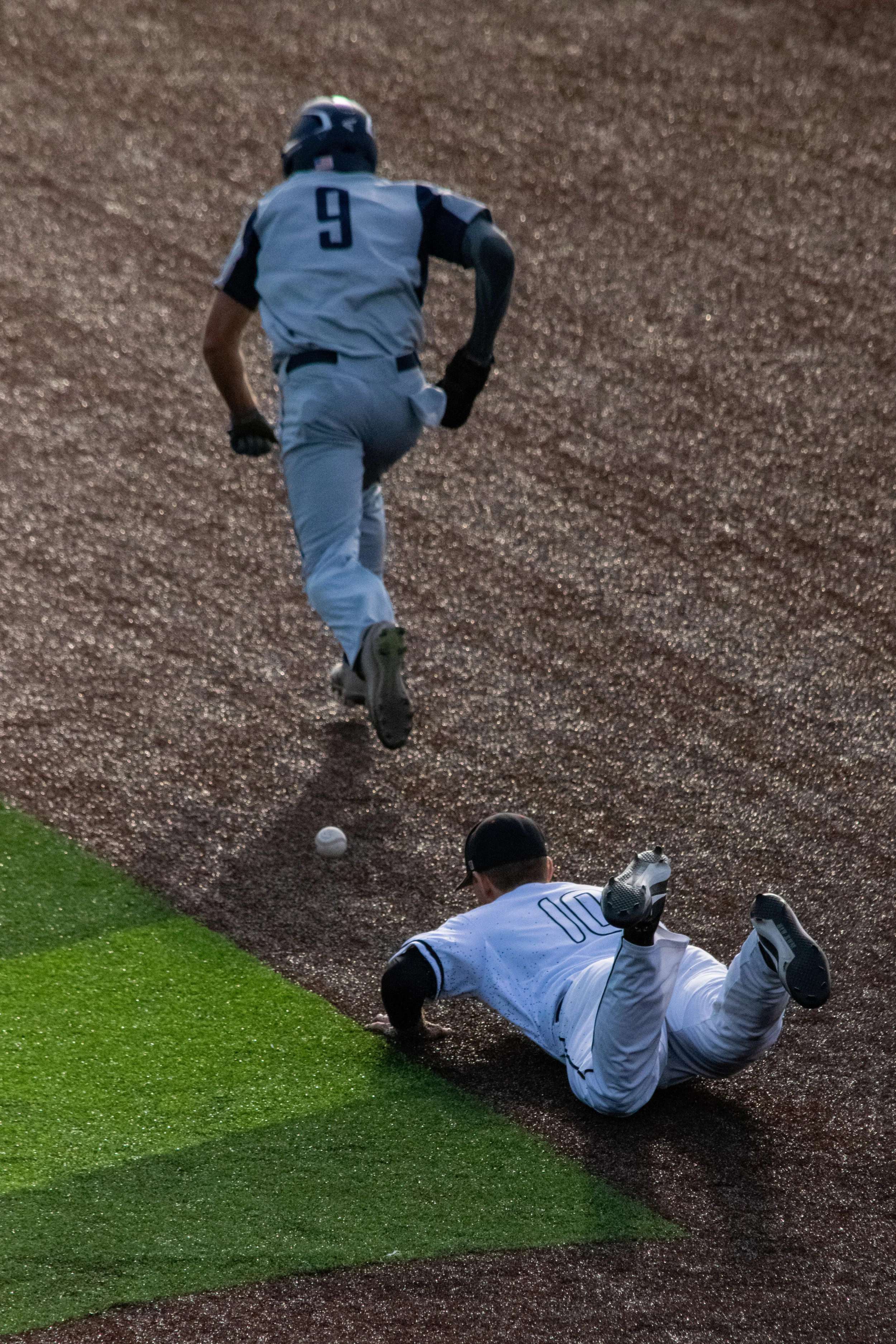 Senior Adam Sasser (10) dives to catch the ball.