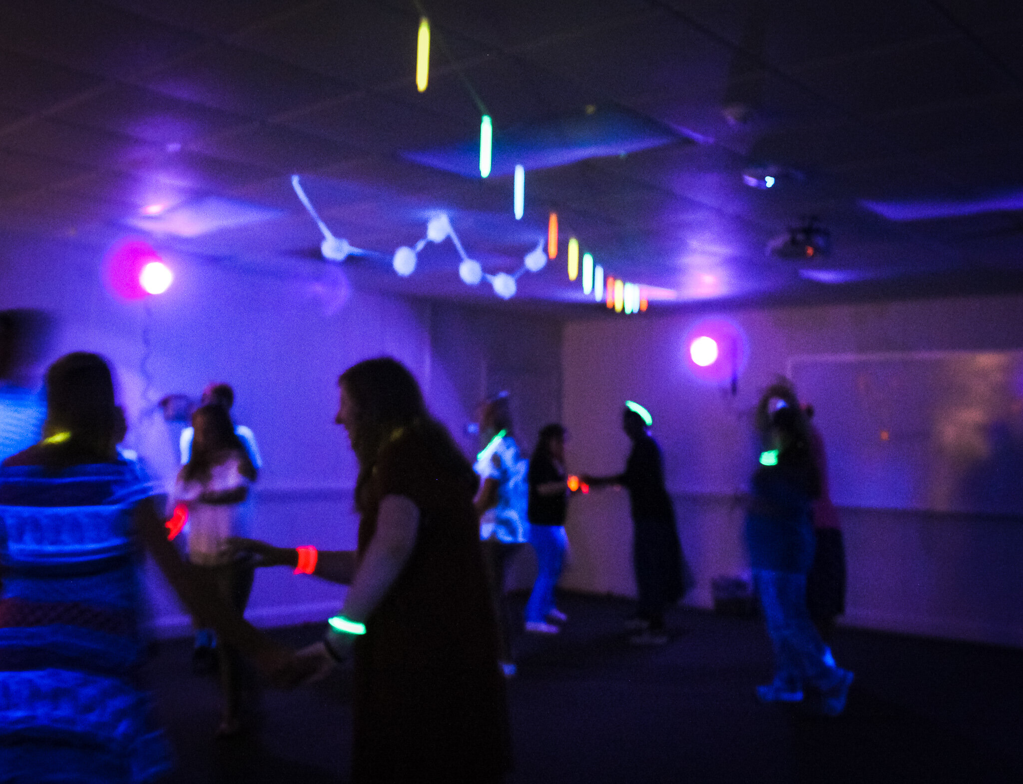 Swing dance club members dancing at the glow party.