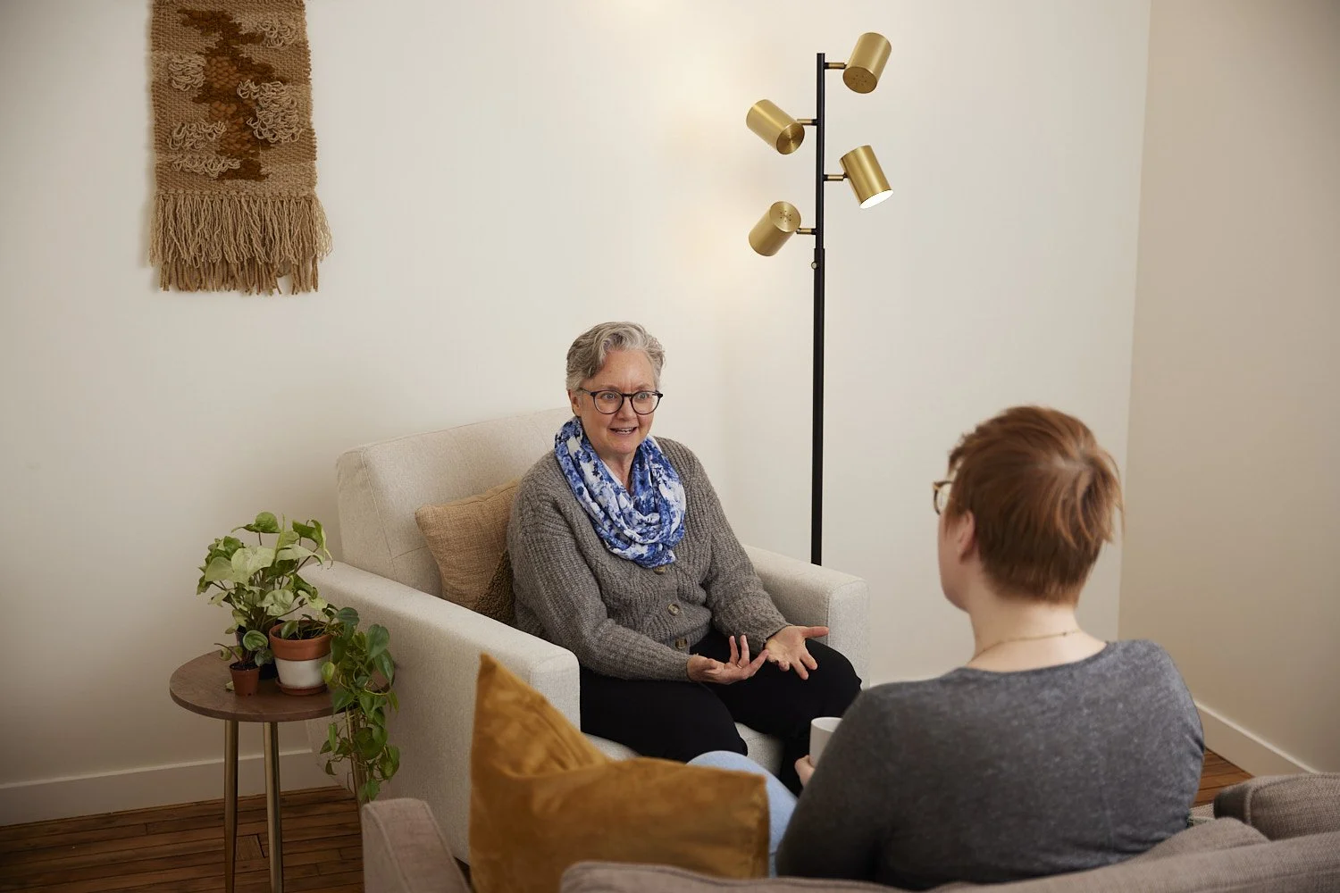 female therapist speaking with a patient.