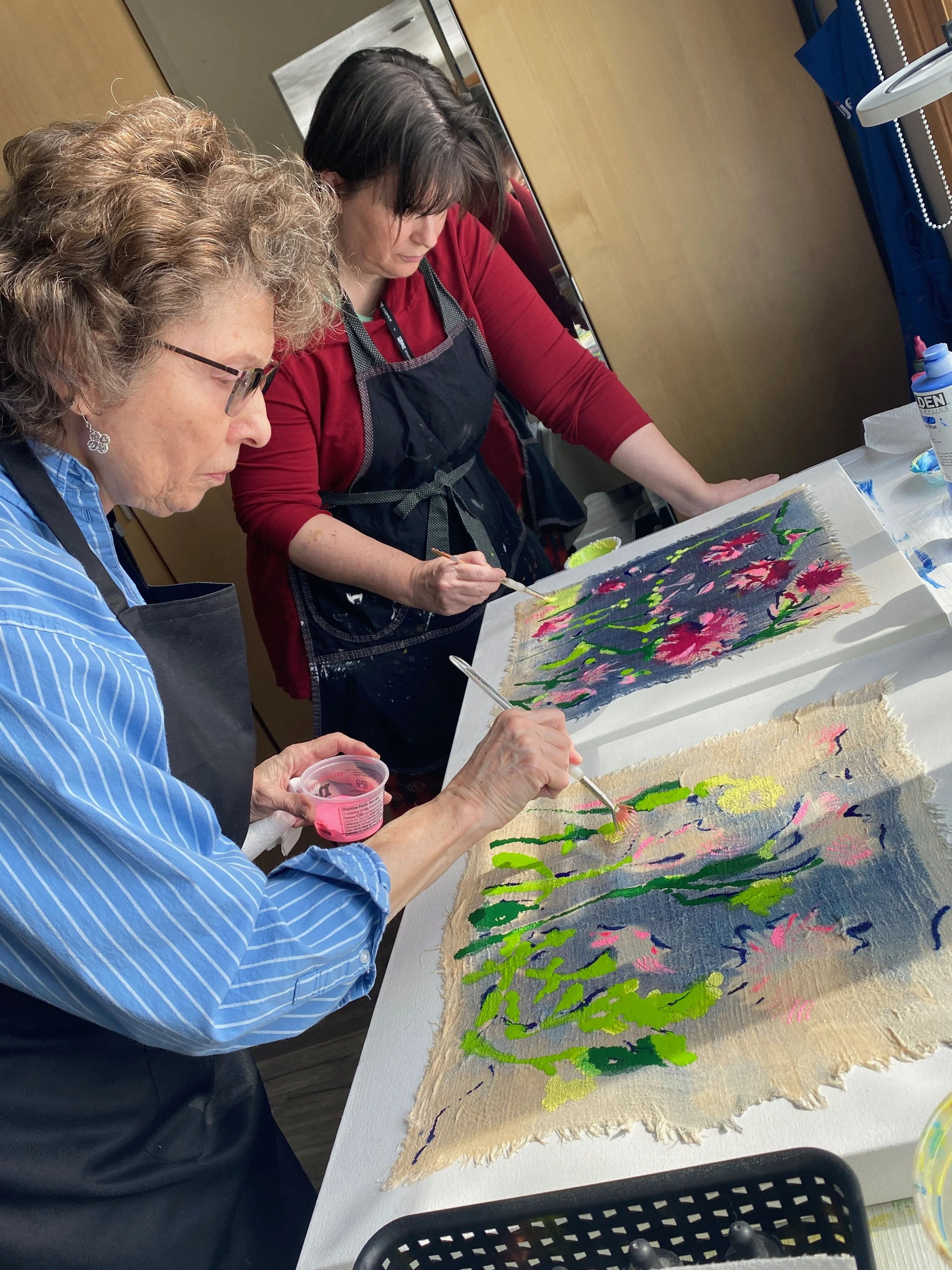 Katherine Rody and Angela Meijer painting cyanotypes.