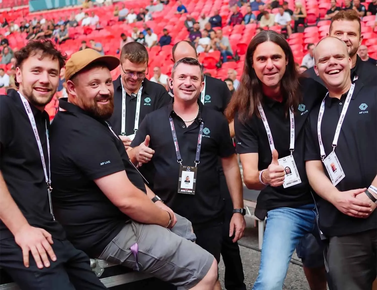 Team members stood around smiling with company director Paul Rose center