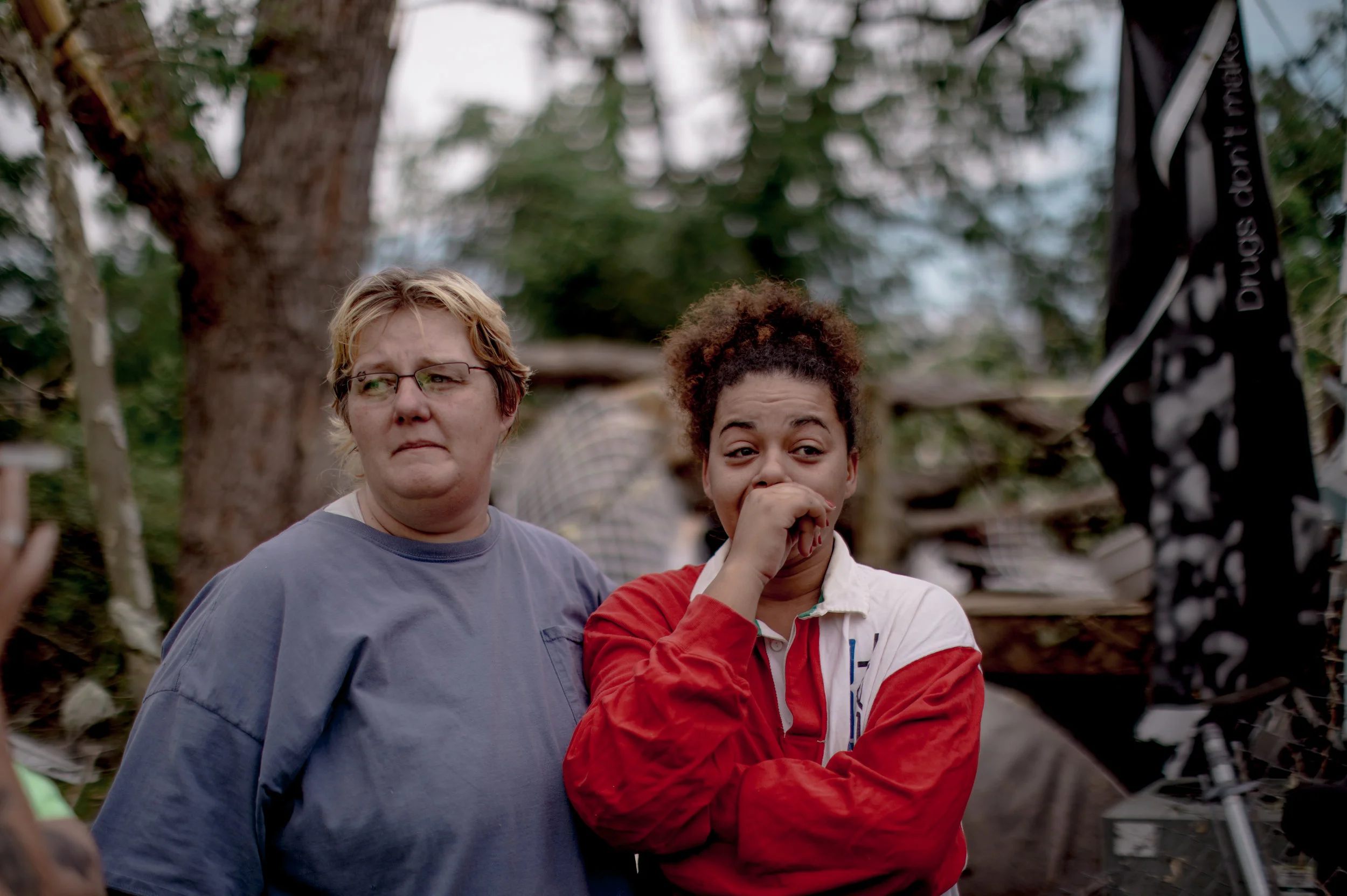 Tina Calderon, left, embraces her neighbor on May 23, 2019 after both of their homes have been destroyed during the night in Jefferson City.