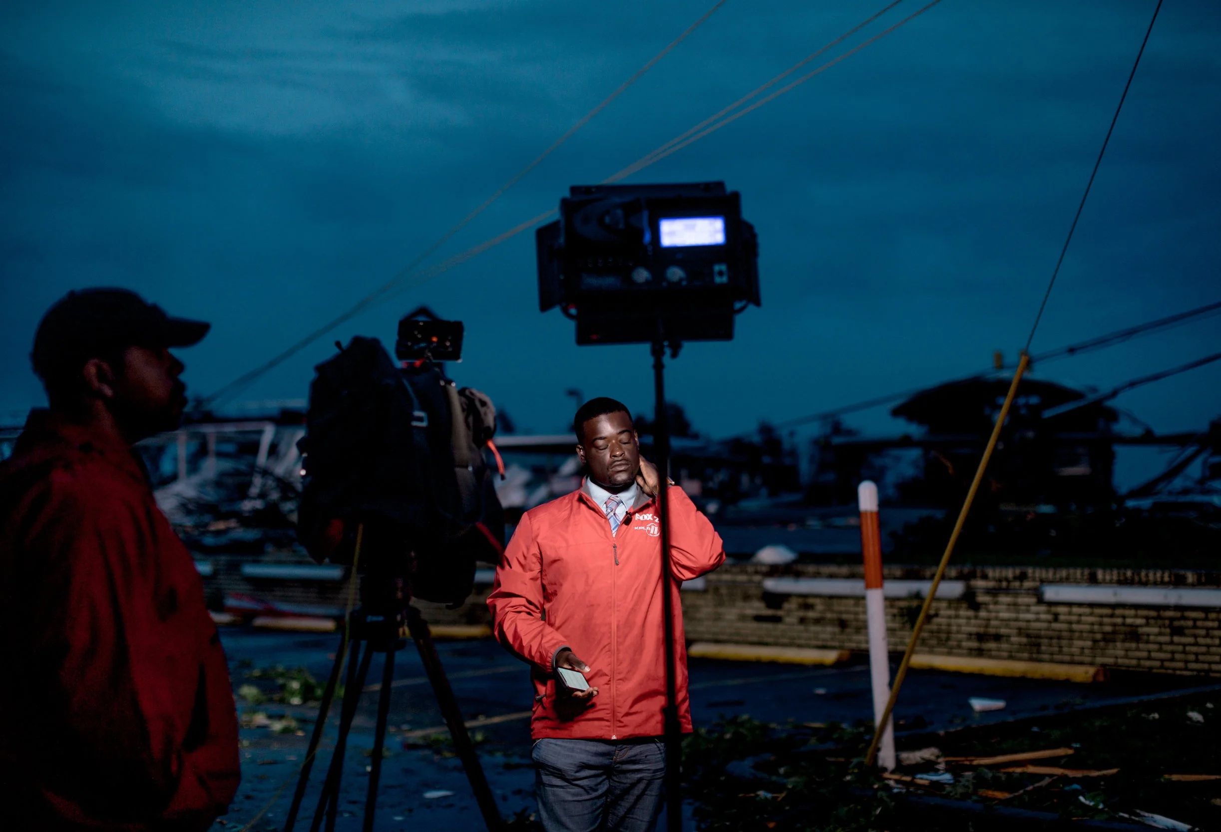 Derrion Henderson, center, a FOX 2 reporter based in St. Louis, stands in front of Ellis Boulevard on May 23, 2019 in Jefferson City.
