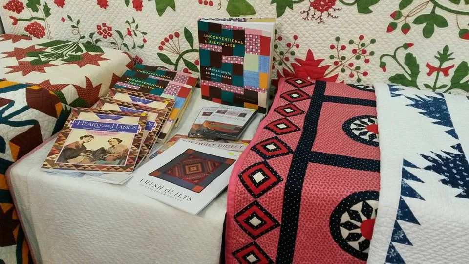 Autographed copies of U&U at the booth for Julie Silber's The Quilt Complex, #937 at the George R. Brown Convention Center. Thanks to Deborah Turner Ursell for the image!