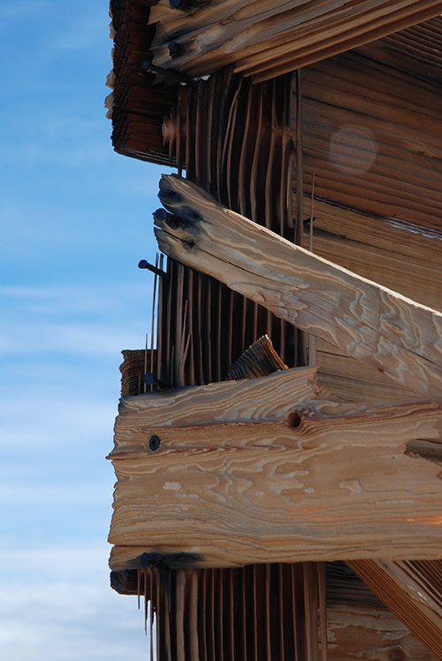 Transit Hut, December 2009. Ice and snow particles blowing in from the plateau have stripped out the softer wood between the growth rings.