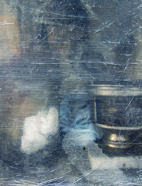 Cemetery votive box, seen through scratched Perspex door. Photograph by Savina Hopkins, 2014. Savina Hopkins is an artist from Melbourne. See more of her artwork at savinahopkins.blogspot.com.au .
