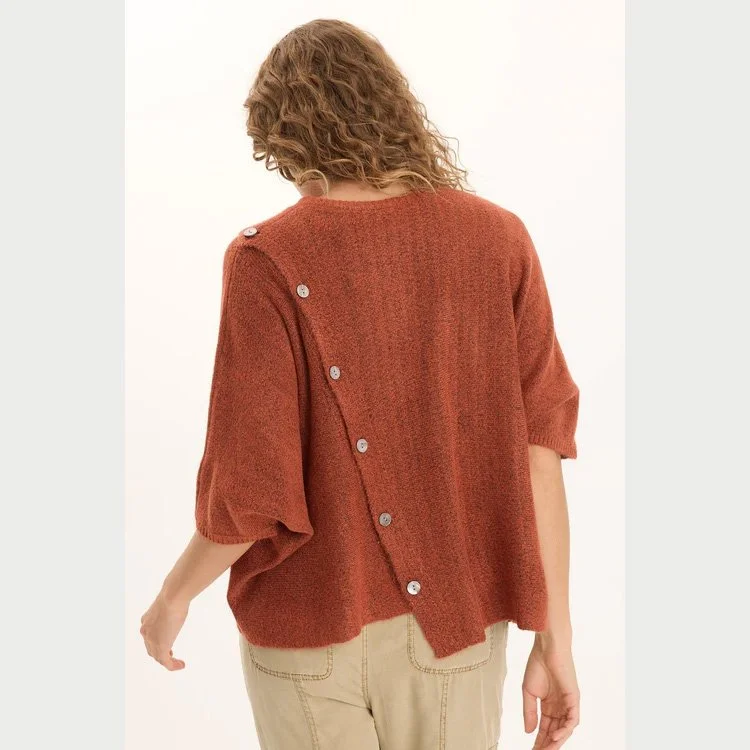 The osiris asymmetrical button detail knit poncho sweater by XCVI in sprightly poppy color