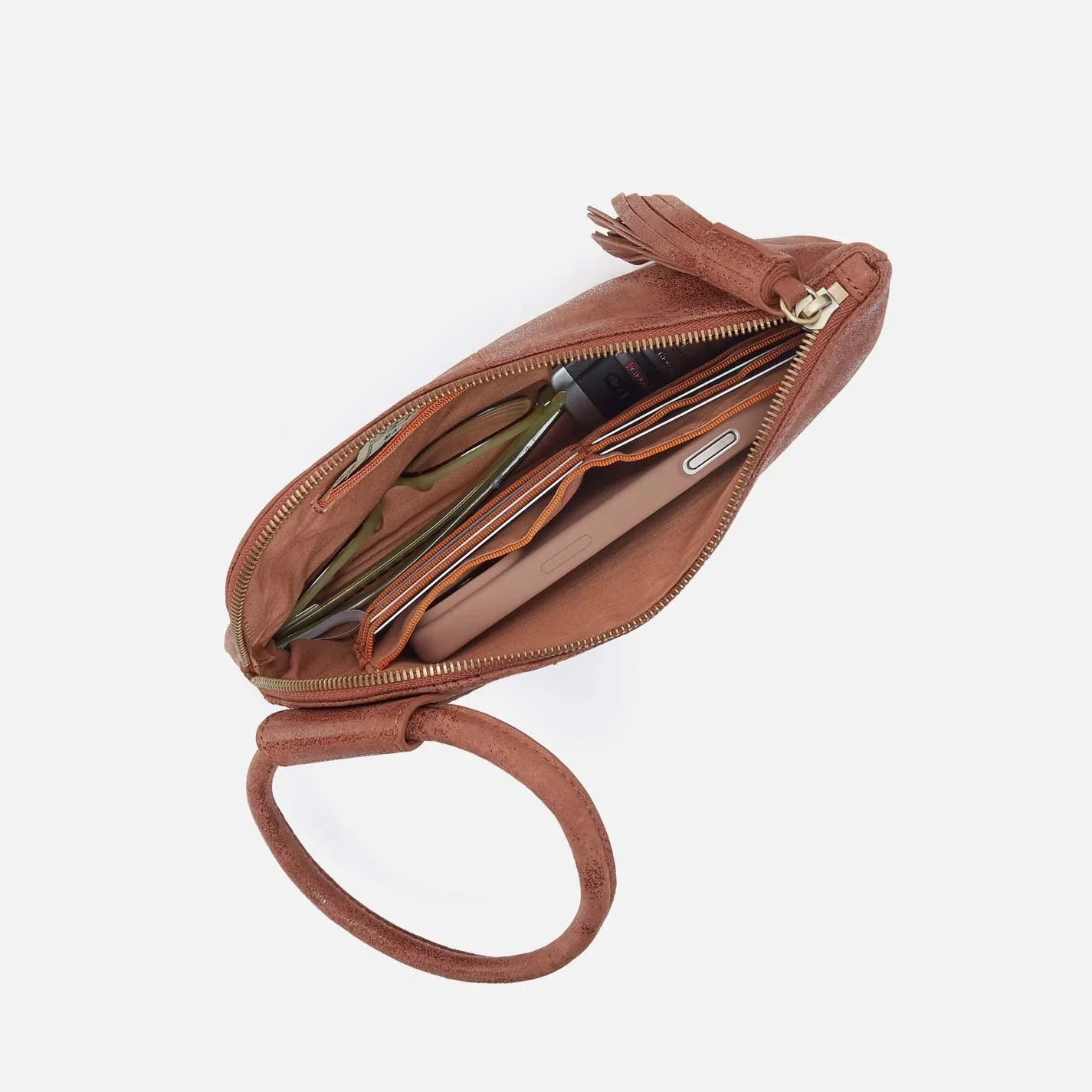 The sable wristlet by Hobo in burnished saddle leather