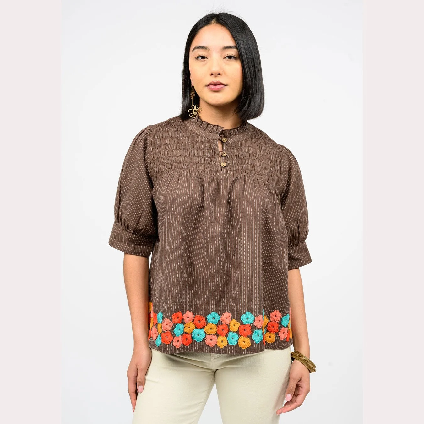 The hem of flowers top by Ivy Jane in brown