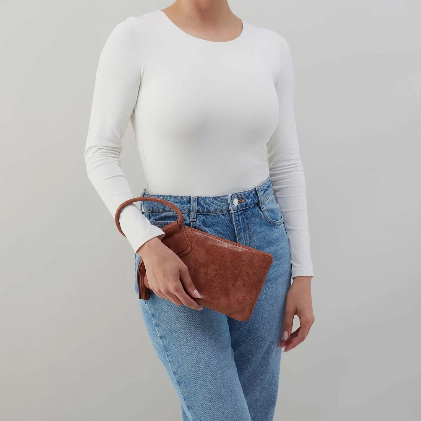 The sable wristlet by Hobo in burnished saddle leather
