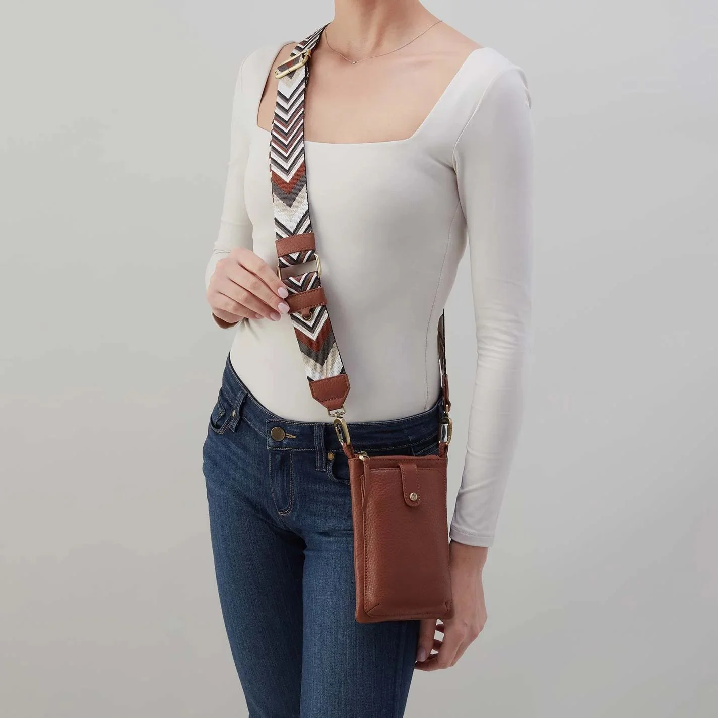 The cass phone crossbody bag in bridle brown leather by Hobo