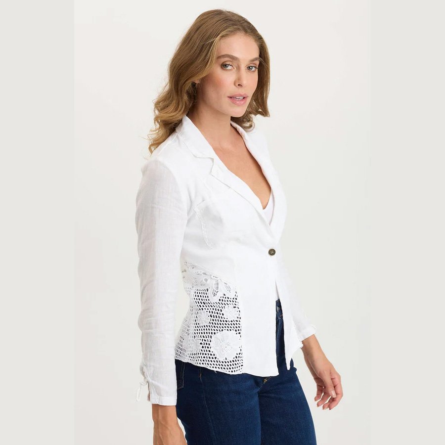 A white linen jacket by XCVI clothing, the trinket jacket in white with crochet detailing, side view