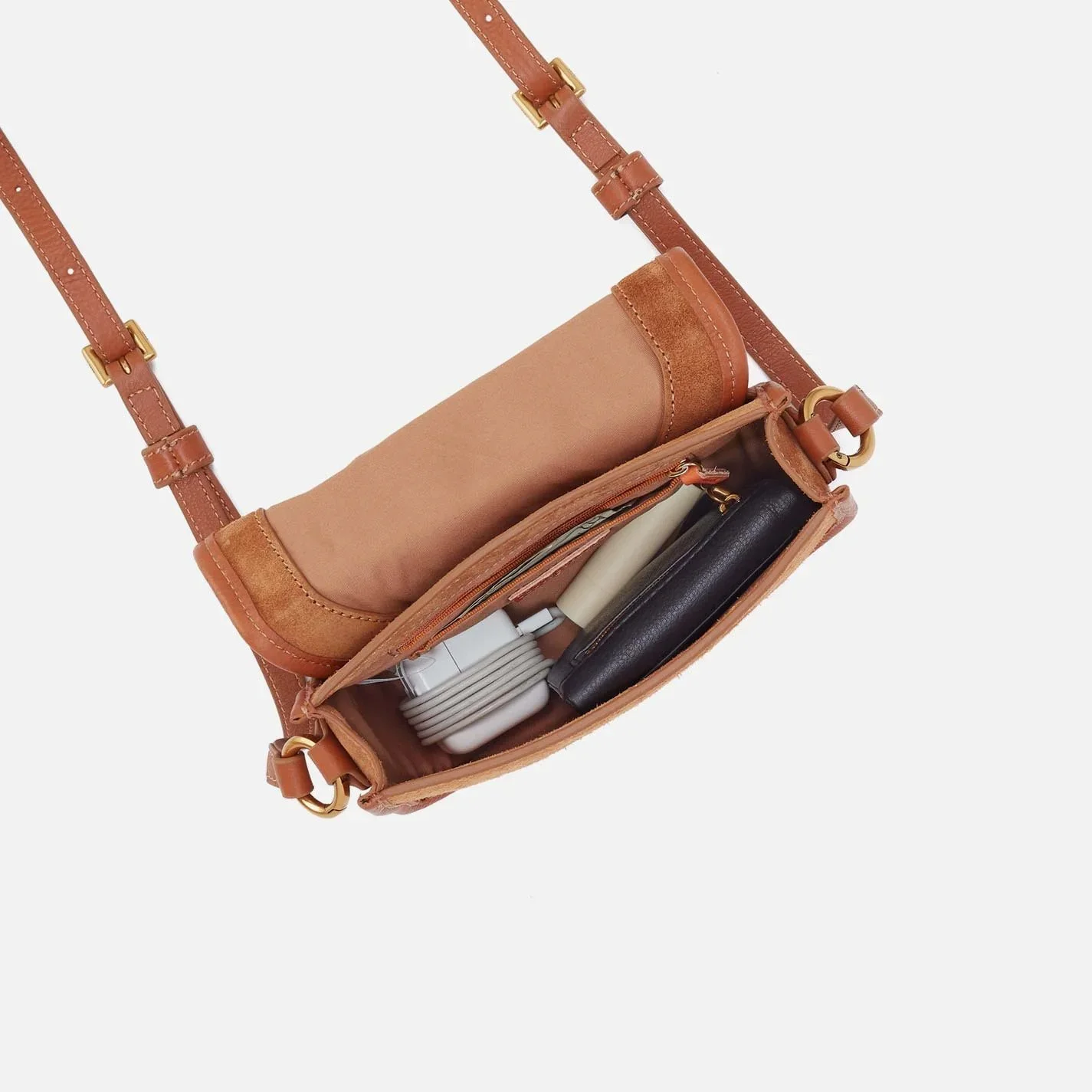The kiva small crossbody handbag by Hobo in oak barrel colored leather