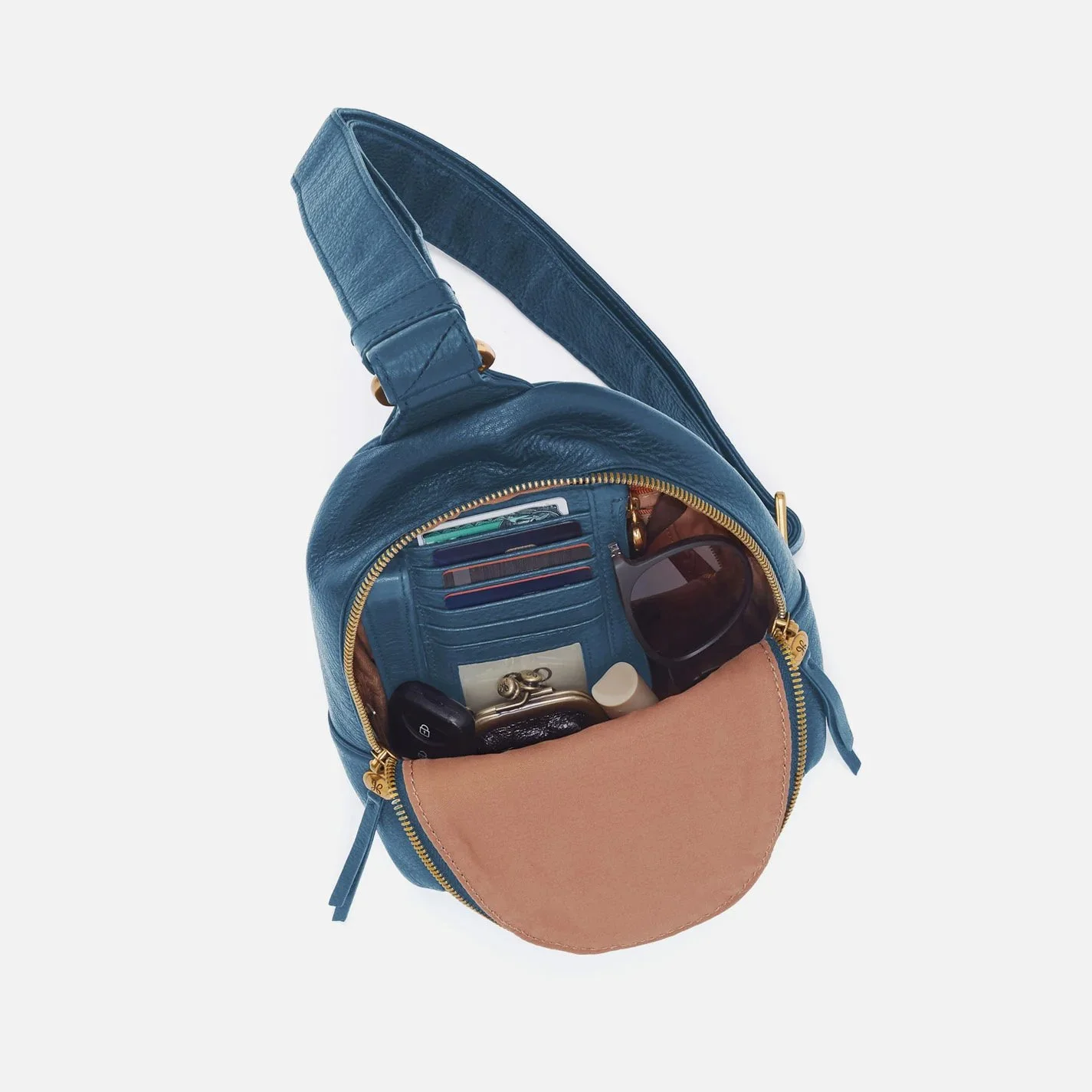 The fern sling bag by Hobo in peacock feather colored leather