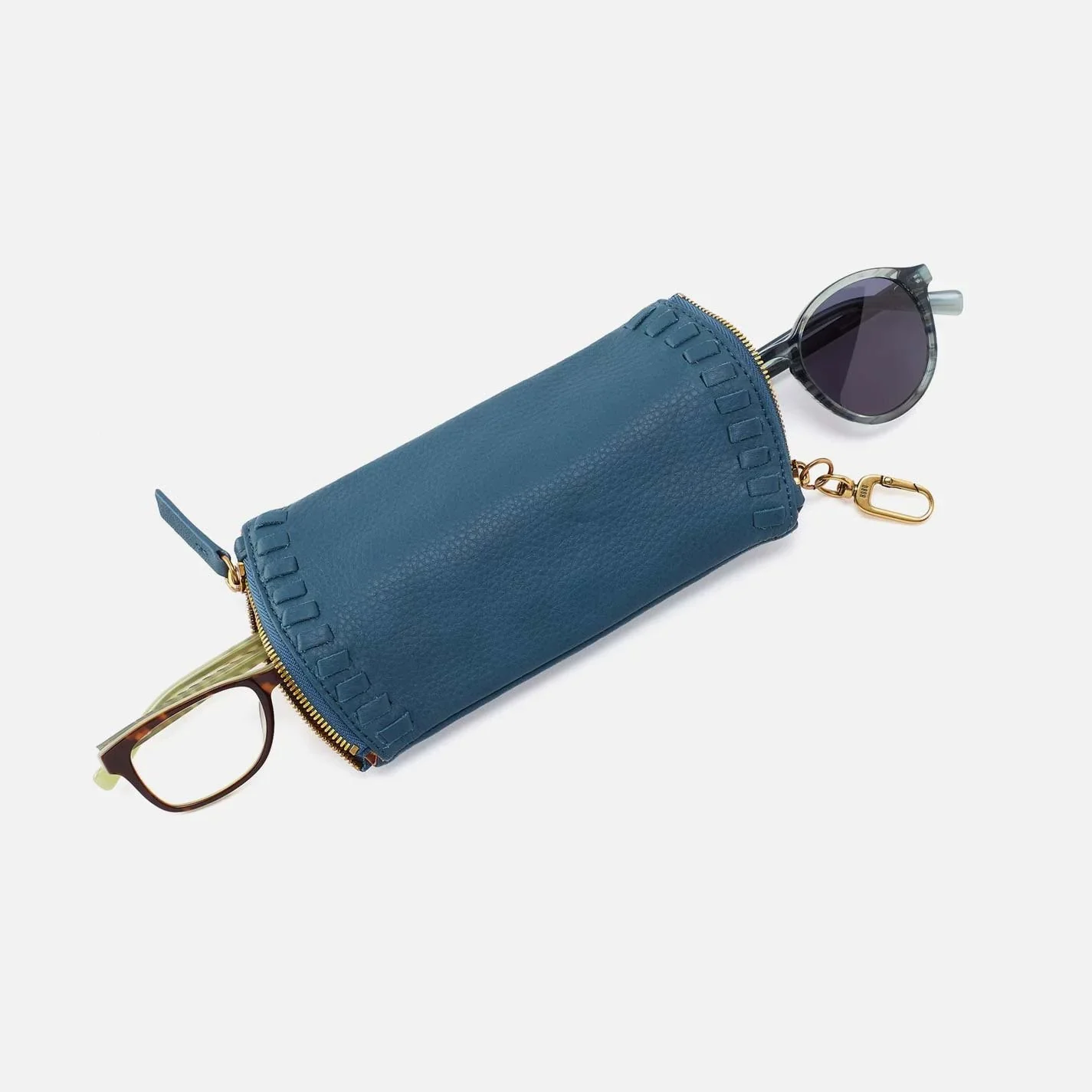The spark double eyeglass case by Hobo in peacock feather colored leather