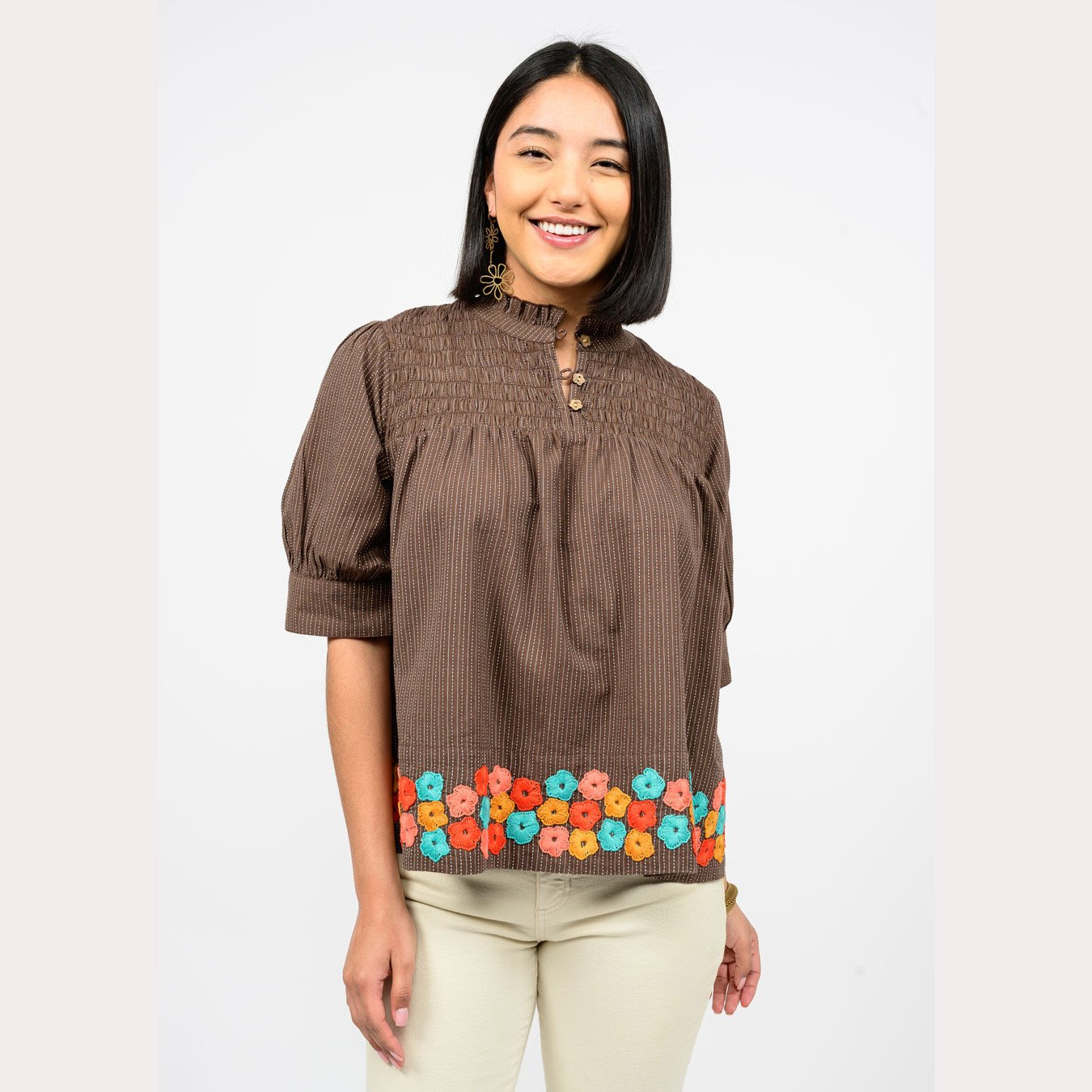 The hem of flowers top by Ivy Jane in brown