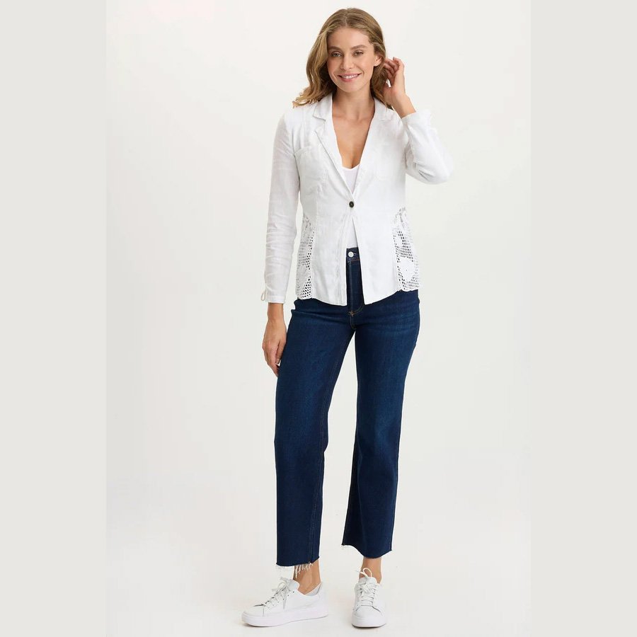 A white linen jacket by XCVI clothing, the trinket jacket in white with crochet detailing, full model view