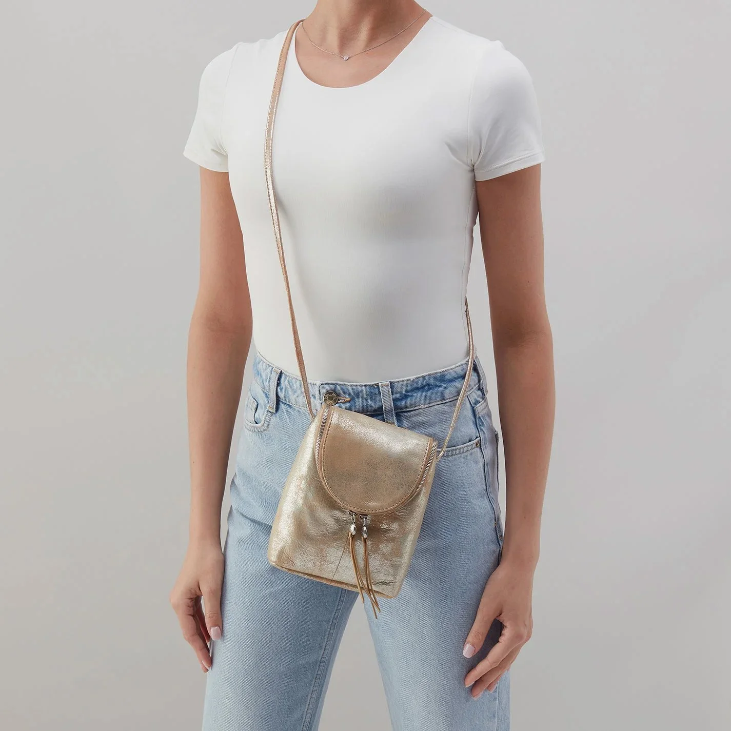 Hobo handbags - the fern crossbody bag in saddle stardust metallic leather
