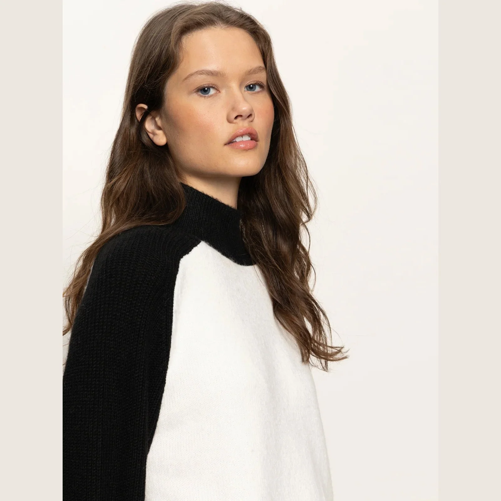 The downtown mock neck sweater by Sanctuary Clothing in black/chalk color combination