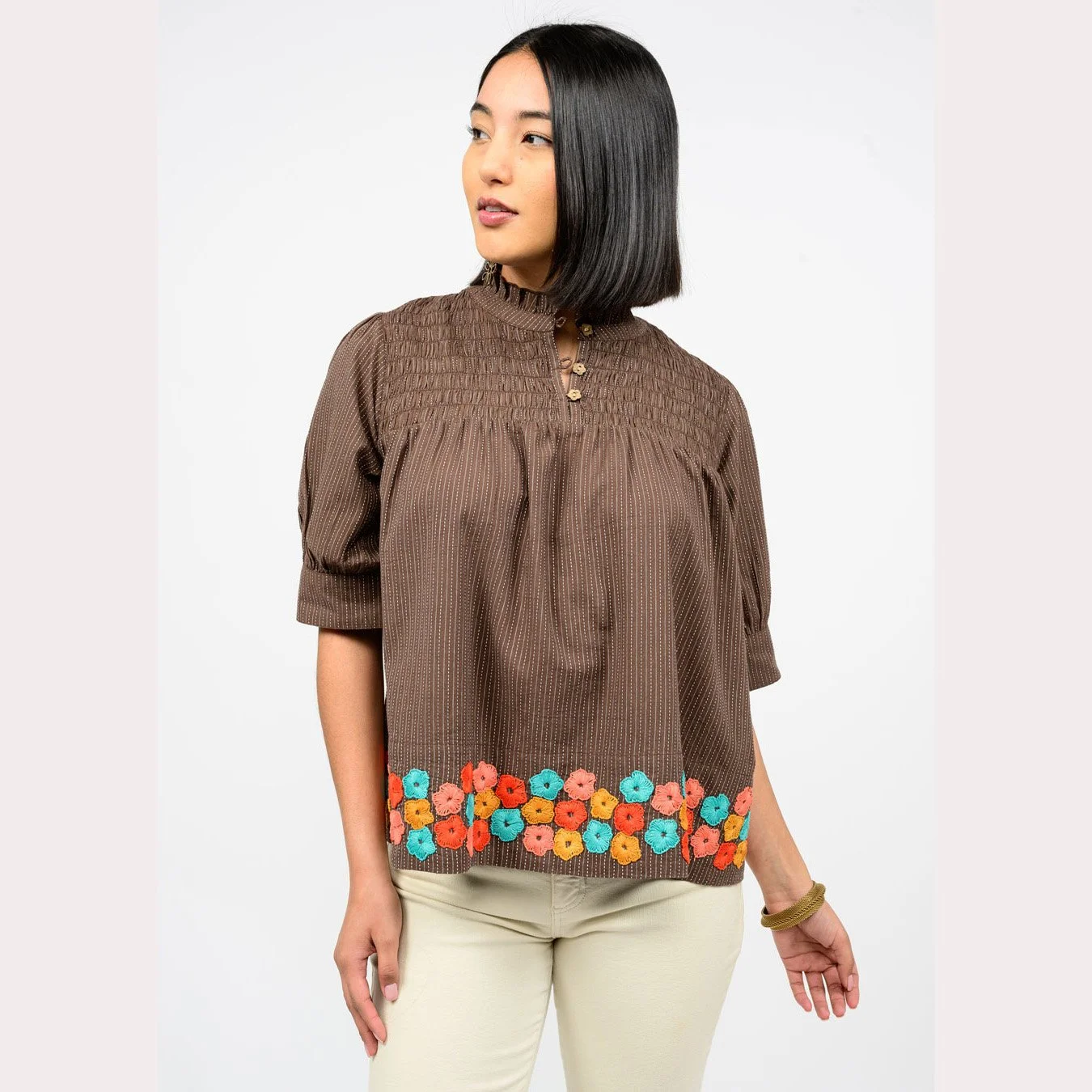 The hem of flowers top by Ivy Jane in brown